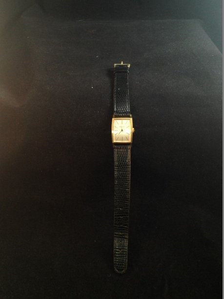 Vintage BULOVA M8 Wristwatch.: This vintage gold tone mechanical wind BULOVA M8 watch measures about 15/16" x 11/16". The watch comes on a black leather band that will fit up to a 8" wrist. The watch is in very nice condition with