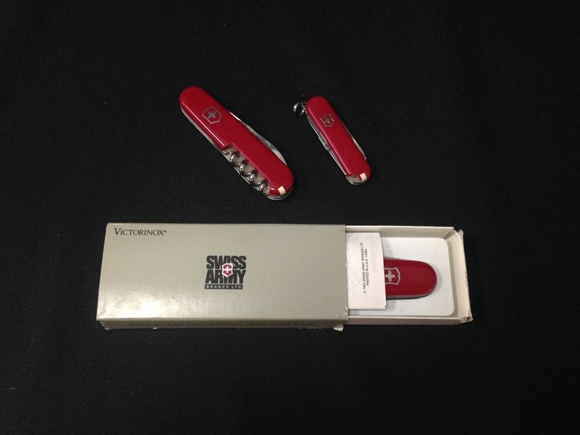 Lot of (3) Swiss Army Knives: One is a Victorinox Still in the original box. The other two knives are Swiss Army with promotional advertising. You get all (3) of them...see pics...Good Luck!!!