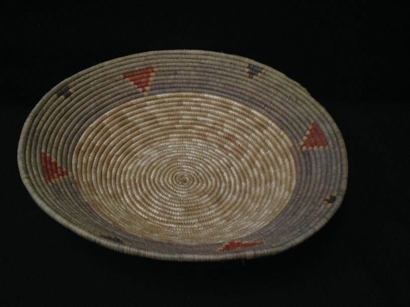 Native American Navajo Coil Basket.: Quite simply, this is a beautifully accomplished early Navajo Coil Basket. Tightly coiled and finely woven, it is decorated with dyed geometric shapes. This antique Navajo ceremonial or wedding basket