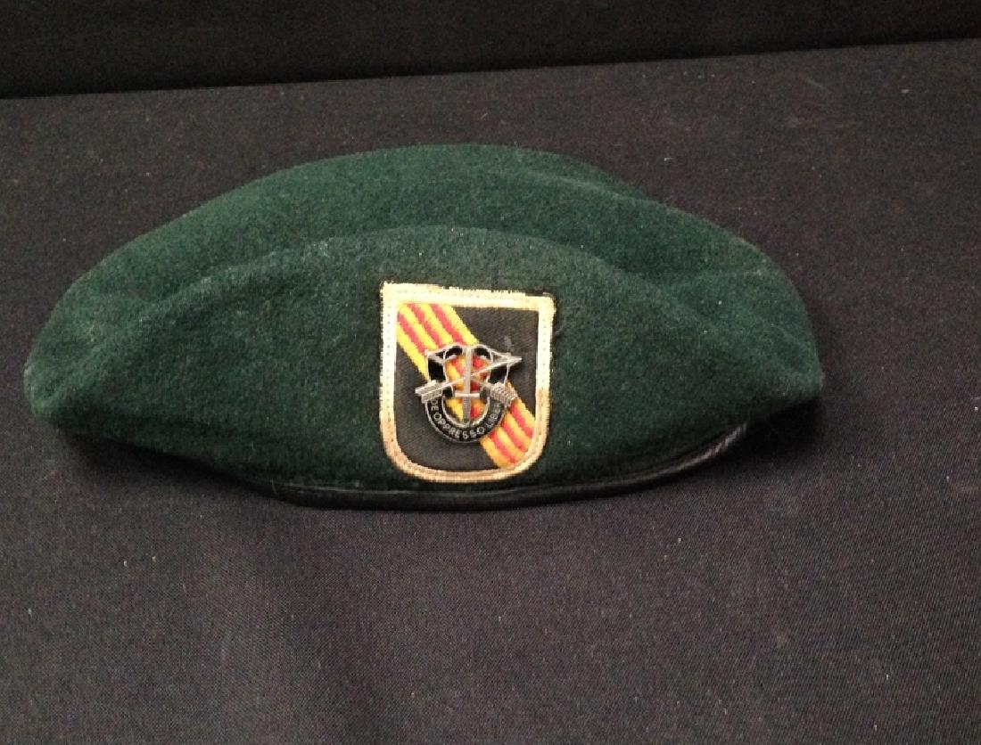 Vietnam Era U.S 5th Special Forces Green Beret: United States 5th Special Forces Vietnam Era 1969 Green Beret with patch & pin. Inside it reads BERET, MANS, WOOL, RIFLE GREEN, DSA 1-3369-B115-682-5615, 100% VIRGIN WOOL, Size 7. Looks to have some a