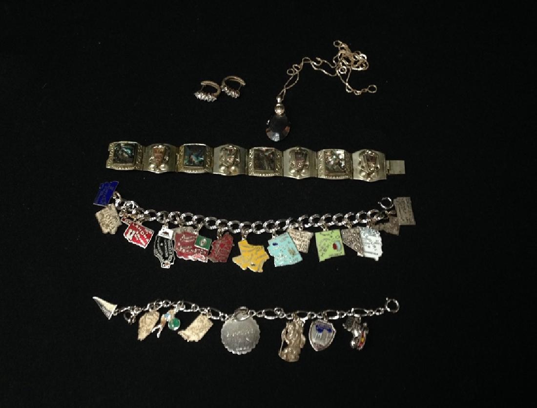 Mixed Lot Vintage Silver/Mexican Jewelry.: This lot includes a lovely drop necklace in Sterling Silver by MILOR. We also have a pretty abalone bracelet and two charm bracelets with sterling charms. Please see photos for more details.