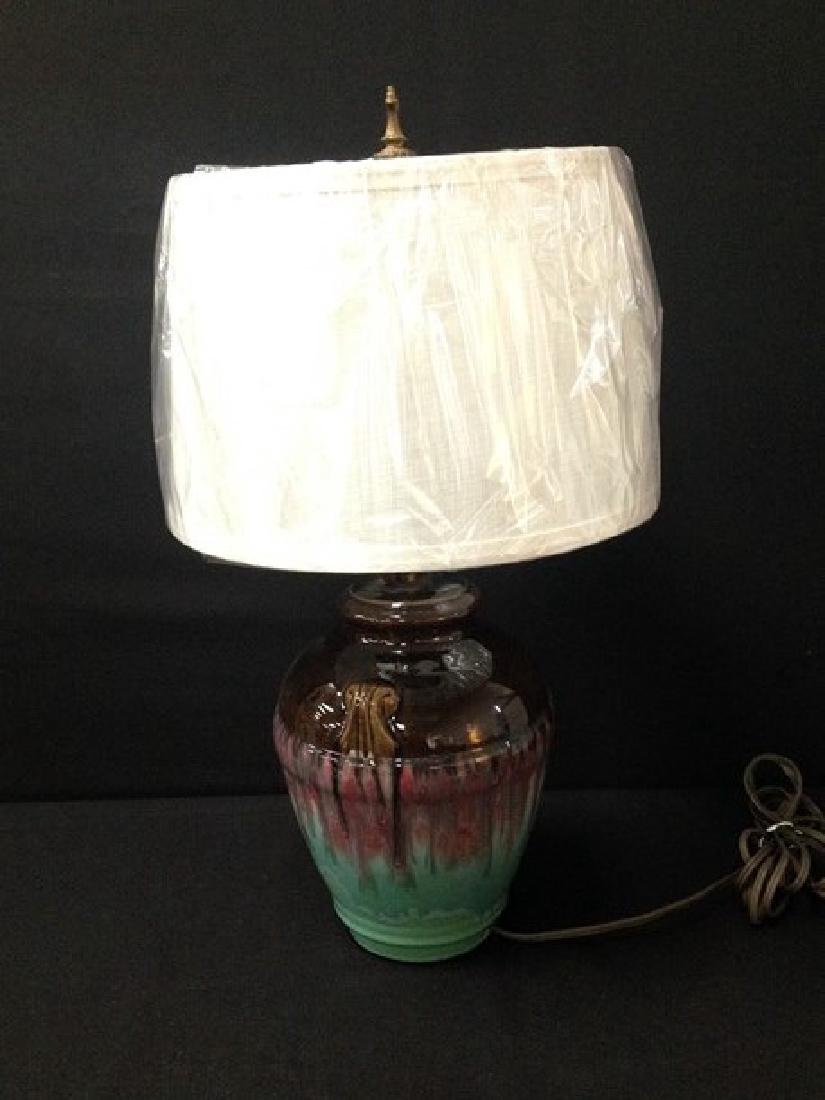 Vintage Art Pottery Lamp: This beautiful circa 1920's art pottery lamp in the style of Weller Turkis but I could find no markings. It has a nice finish and gloss. The original metal work and sockets are all intact and the base