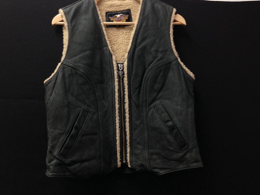 Harley Davidson Ladies Leather Vest Size M: L M- This a nicely preserved leather vest with a faux fur lining. The vest is authentic Harley and 100 leather with a lining of 100% acrylic...adjustable strap in the back...nice...Good Luck!!!