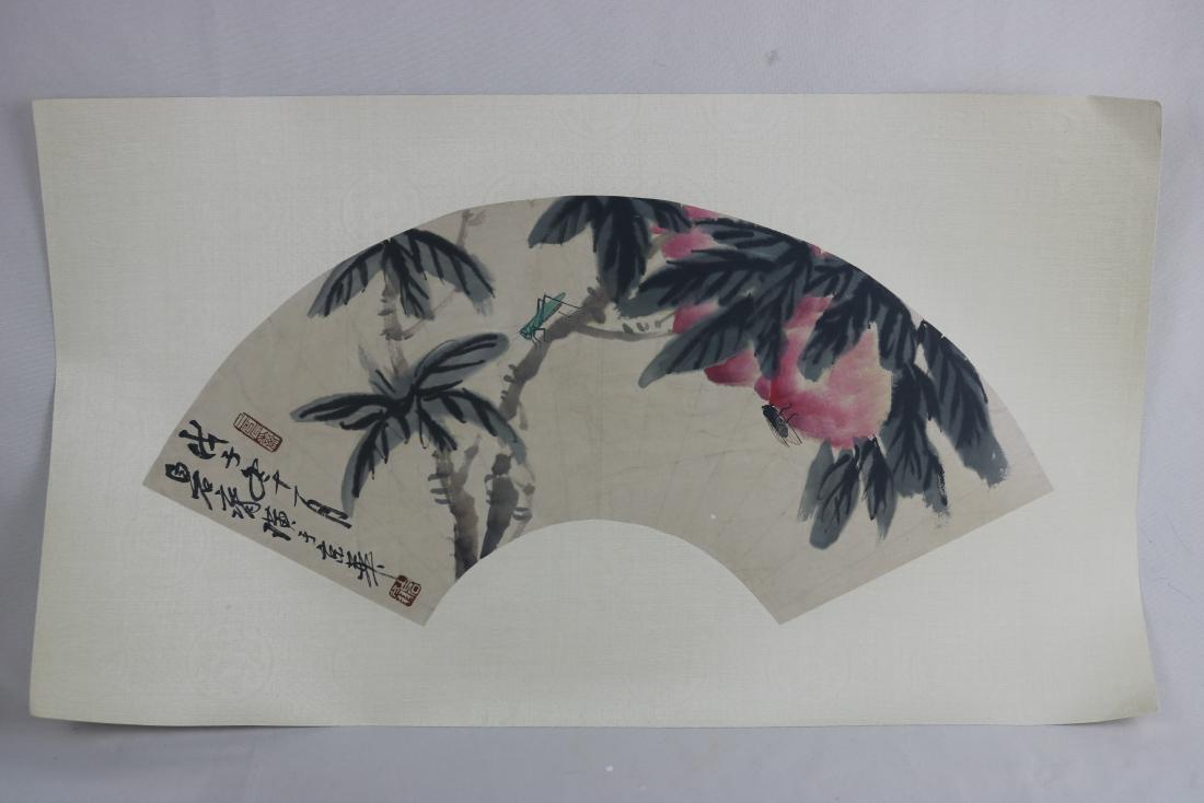 Chinese Fan Shape Painting: Chinese fan shape painting, ink and color on paper, signed Qi Bai Shi (1864-1957); featuring peaches and insect surmonunted on a tree branch, the left with a short colophon and seals. L: 54 cm, W: 18 