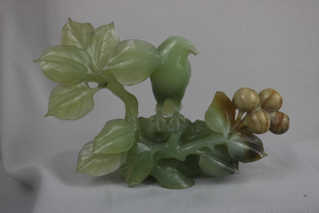 Chinese Jade Bird: Chinese carved jade bird; perched on a tree branch; H: 15 cm, L: 22 cm