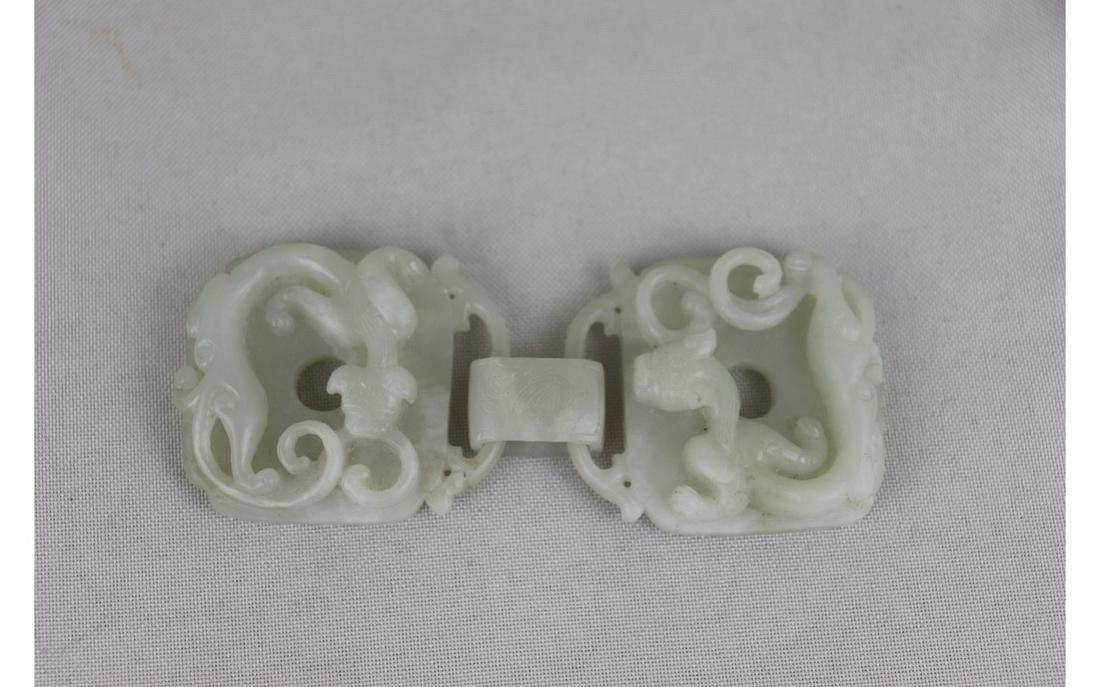 Chinese White Jade Belt Buckle: Chinese White Jade Belt Buckle, carved with dragon, L 10 x W 4 cm.