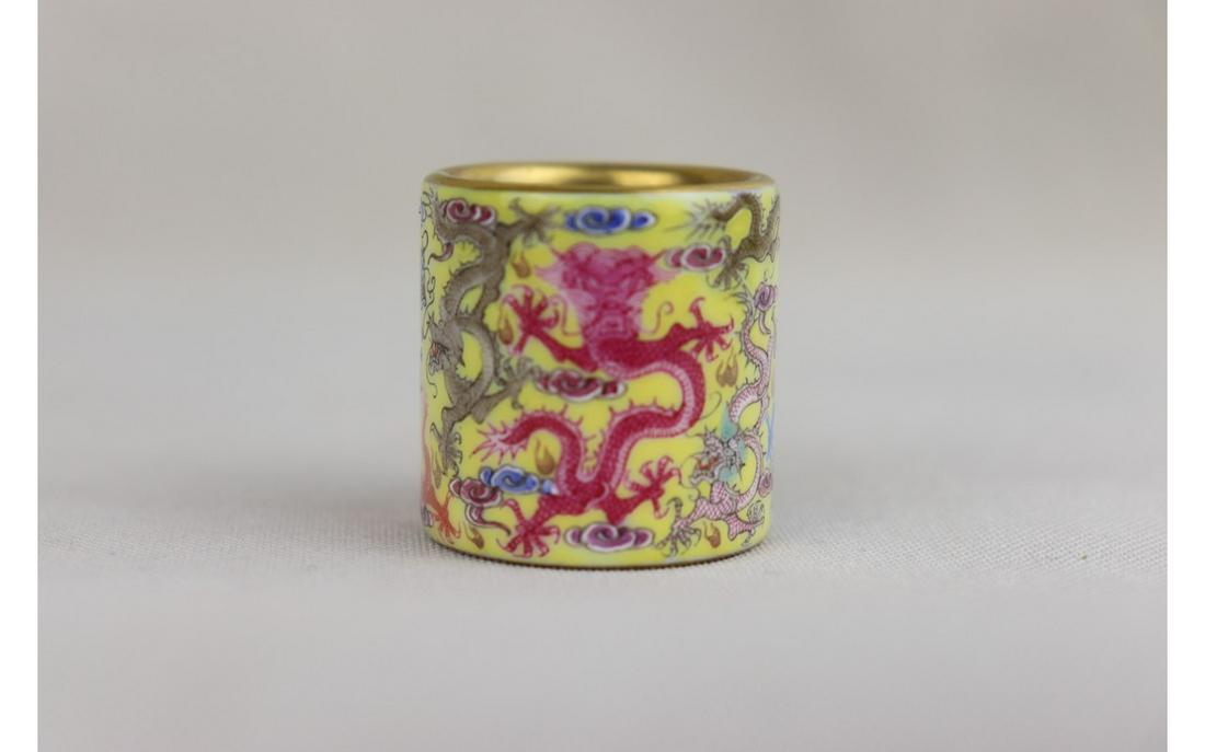 Chinese Yellow-Ground Famille Rose Thumb Ring: Chinese Yellow-Ground Famille Rose Porcelain Thumb Ring,featuing five dragon, four characters QIANGLONG mark, H 3x D 2.5 cm.