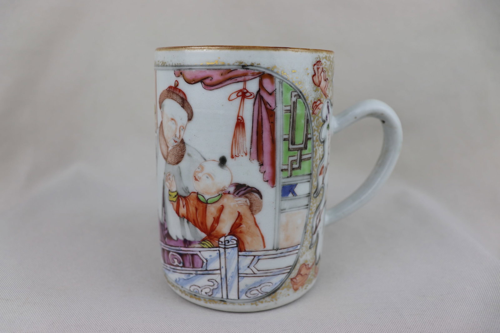 Chinese Famille Rose Mug: The Period of Republic of China Famille Rose Porcelain Mug, featuring figures, unglazed on base, H 11 x L 17 x D 8 cm.