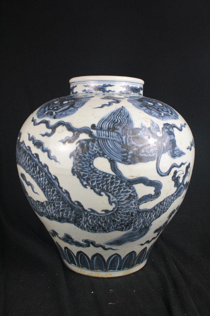 Chinese Blue and White Porcelain Jar: Chinese blue and white porcelain jar; decorated with dragon. Xuande mark. H: 37 cm, W: 37 cm.