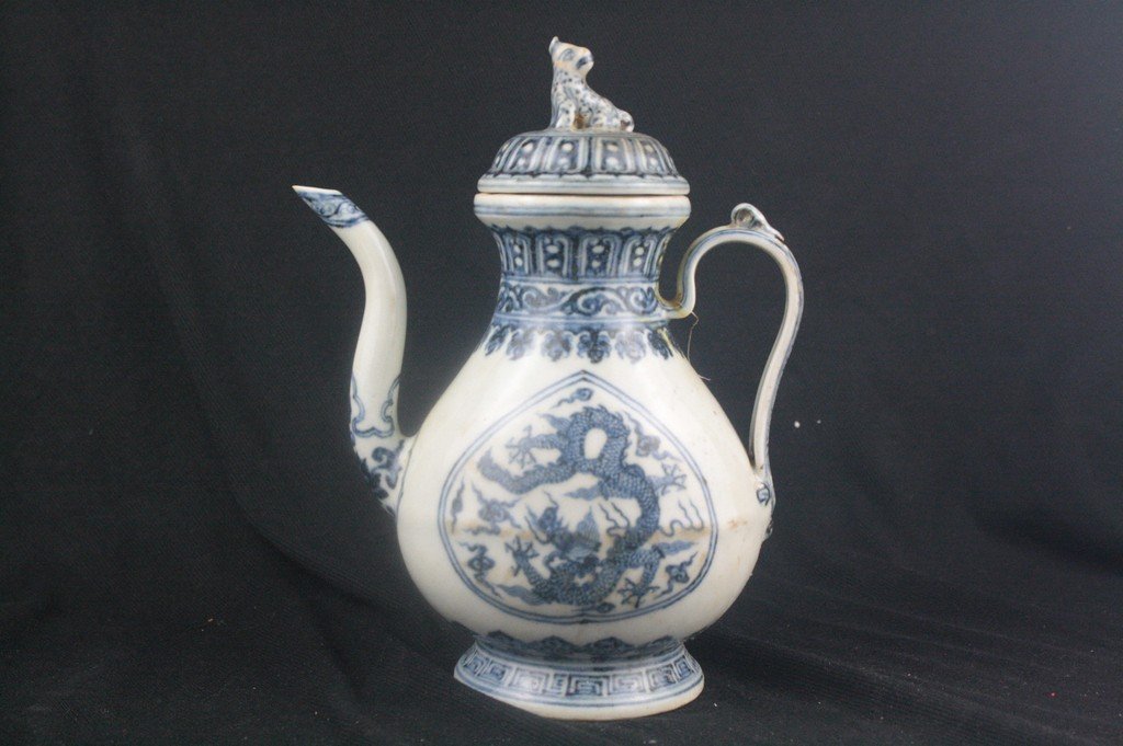 Chinese Blue and White Porcelain Ewer: Chinese blue and white porcelain ewer with cap; decorate with dragon. Xuande mark. H: 22.5 cm, W: 17 cm.