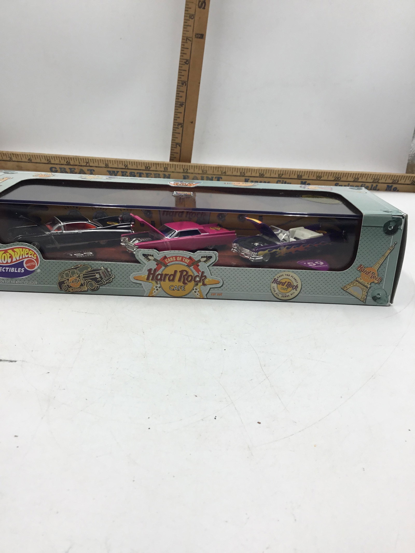 2000 Hot Wheels 1:64 Hard Rock Cafe #27835: Three car set of the Hard Rock Cafe three super cool Caddies with “Jaws” sized fins including a 59 Eldorado, ‘63 coupe Deville, and a ‘59 convertible still in box never been opened in factory 