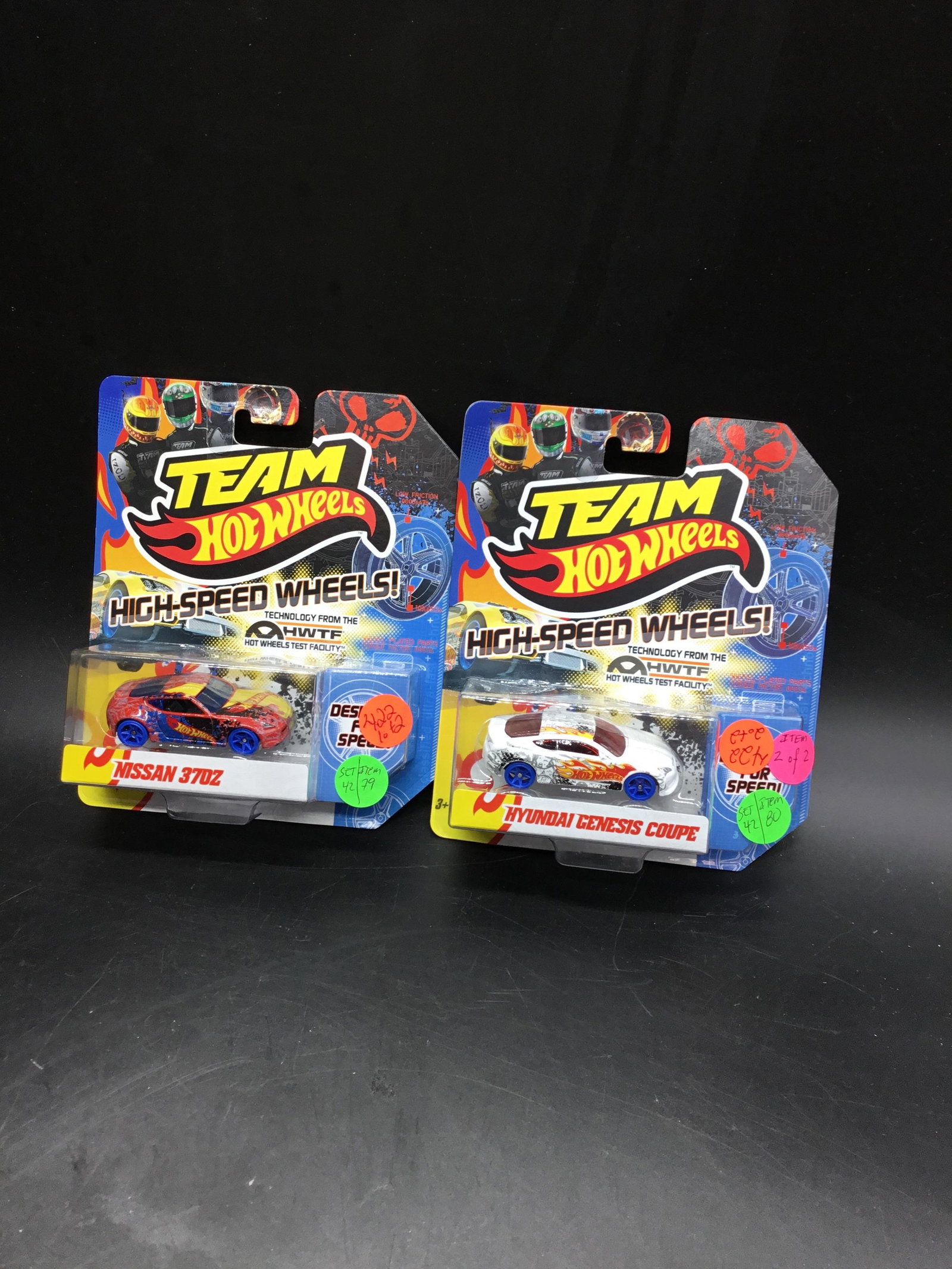 Set of 2 Team Hot Wheels: Set include Hyundai genesis coupe a Nissan 370 Z from team hot wheels high speed wheels boat with blue wheels. #X0129 Nissan 370 Z and #X0133 Hyundai Genesis Coupe