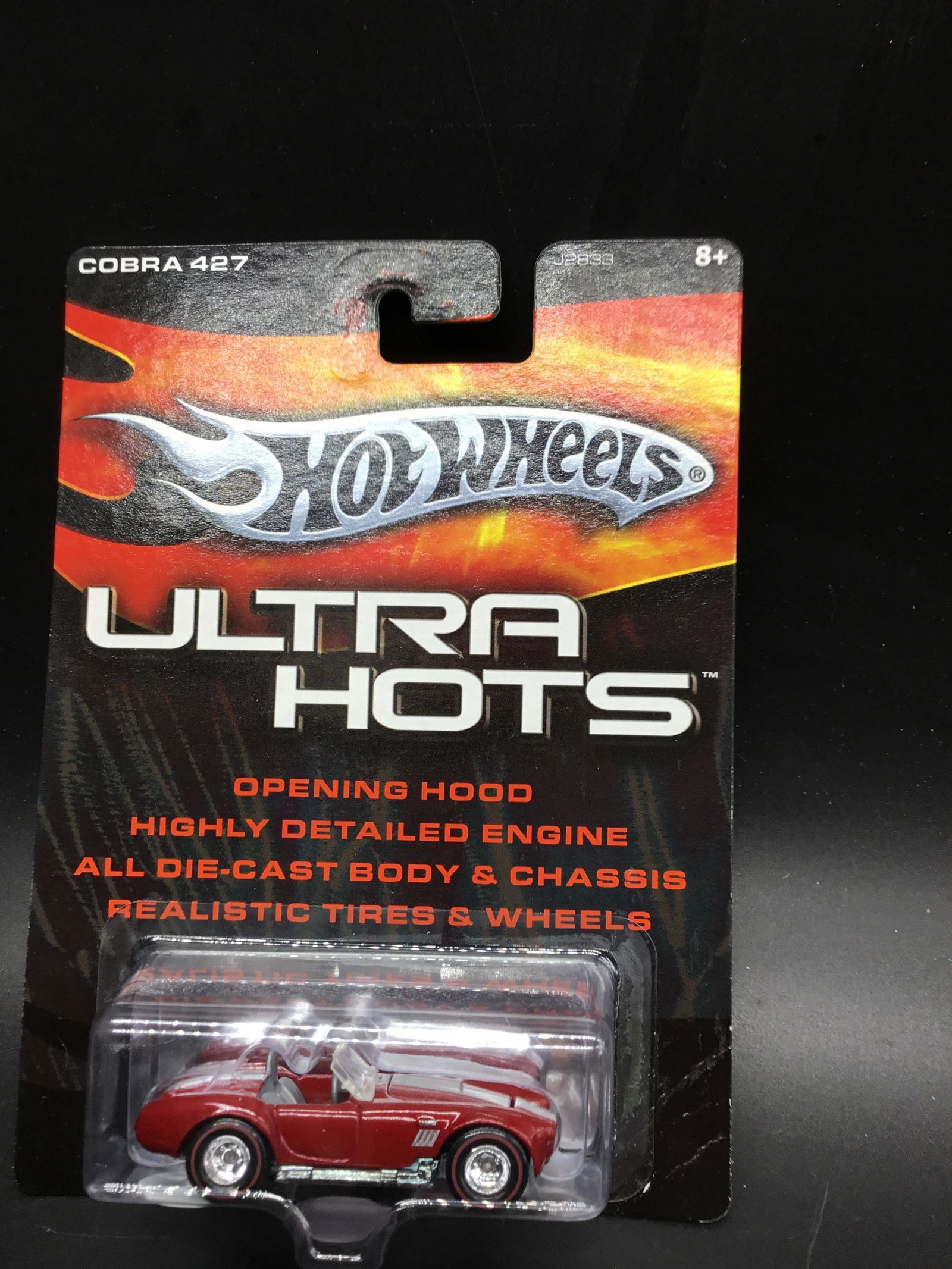 #J2833 Hot Wheels 2006 Ultra Hot Shelby cobra 427: From 2006 the ultra hot was a special edition of muscle cars hot rods and classic rides. This example is the Shelby cobra 427SC done in dark red and red line real riders!!