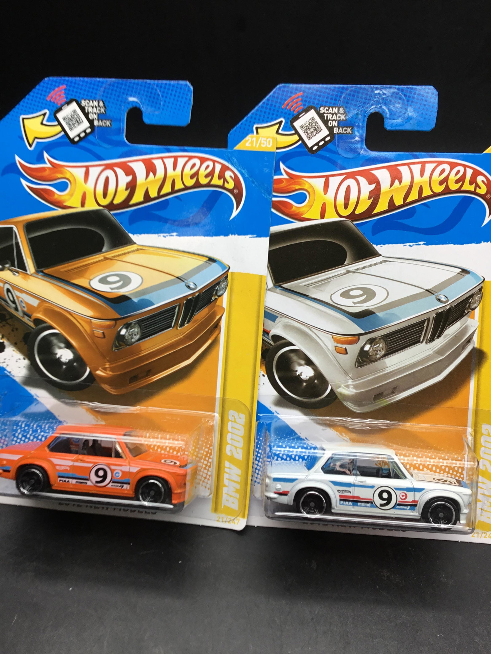 Set of two 2012 Hot Wheels #21 BMW: Set of two 2012 Hot Wheels #21 BMW 2002 one is orange in the other one is white.