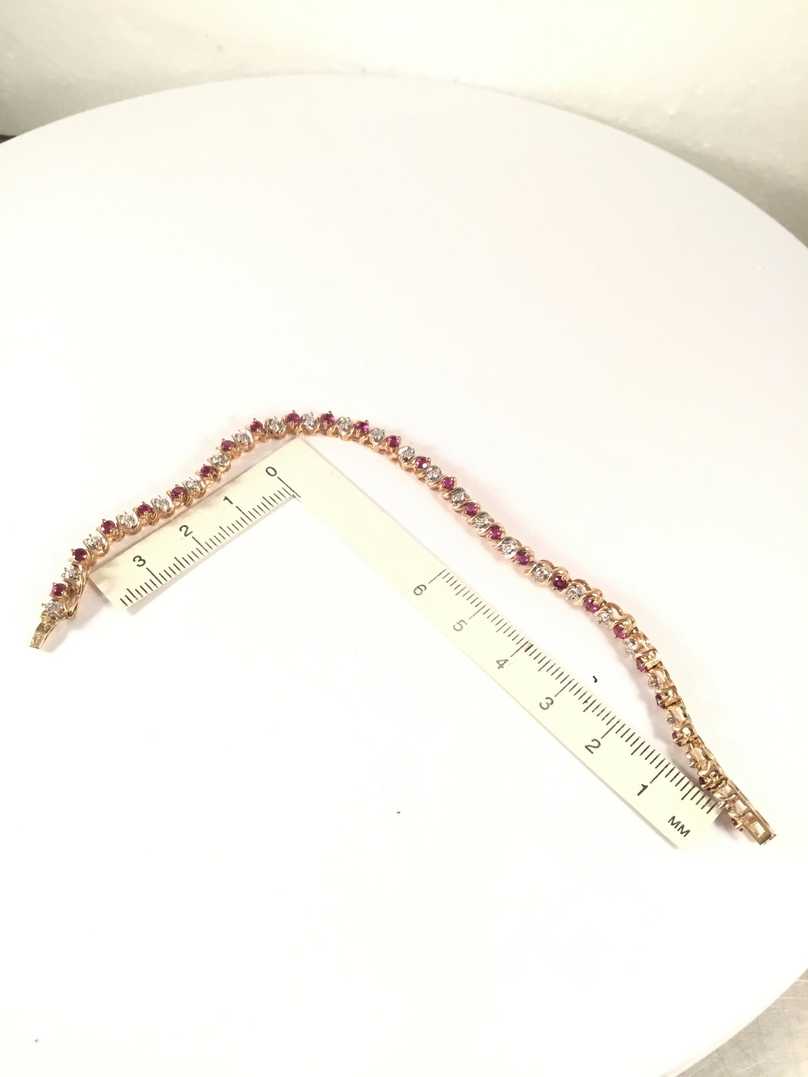 7 inch bracelet with red and clear stones: 10kt bracelet #220182