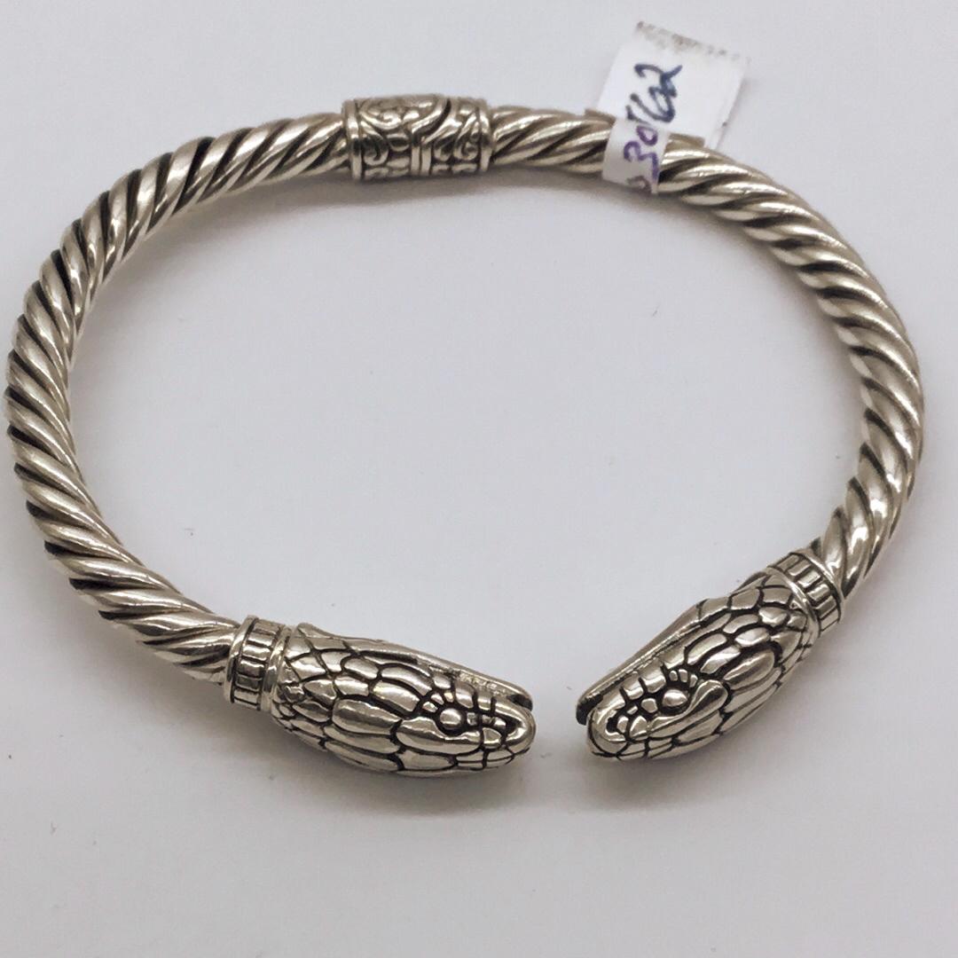 Silver hinged cuff bracelets with snake head ends (1 of 3)