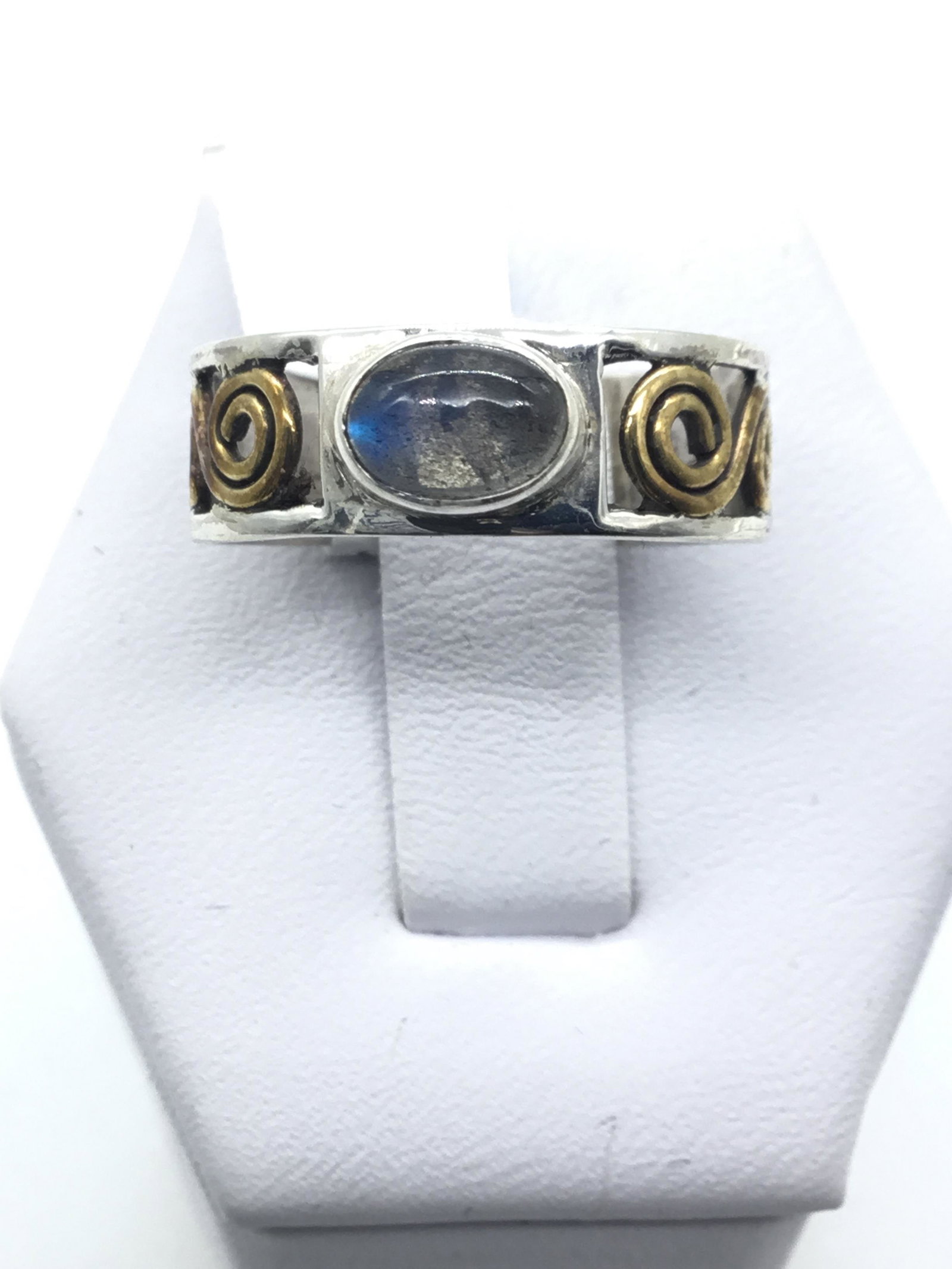 Silver ring with gold colored swirl and moonstone: Silver ring with gold colored swirl and moonstone size 8.25 marked 925 weighs 3.2 grams #2202.4