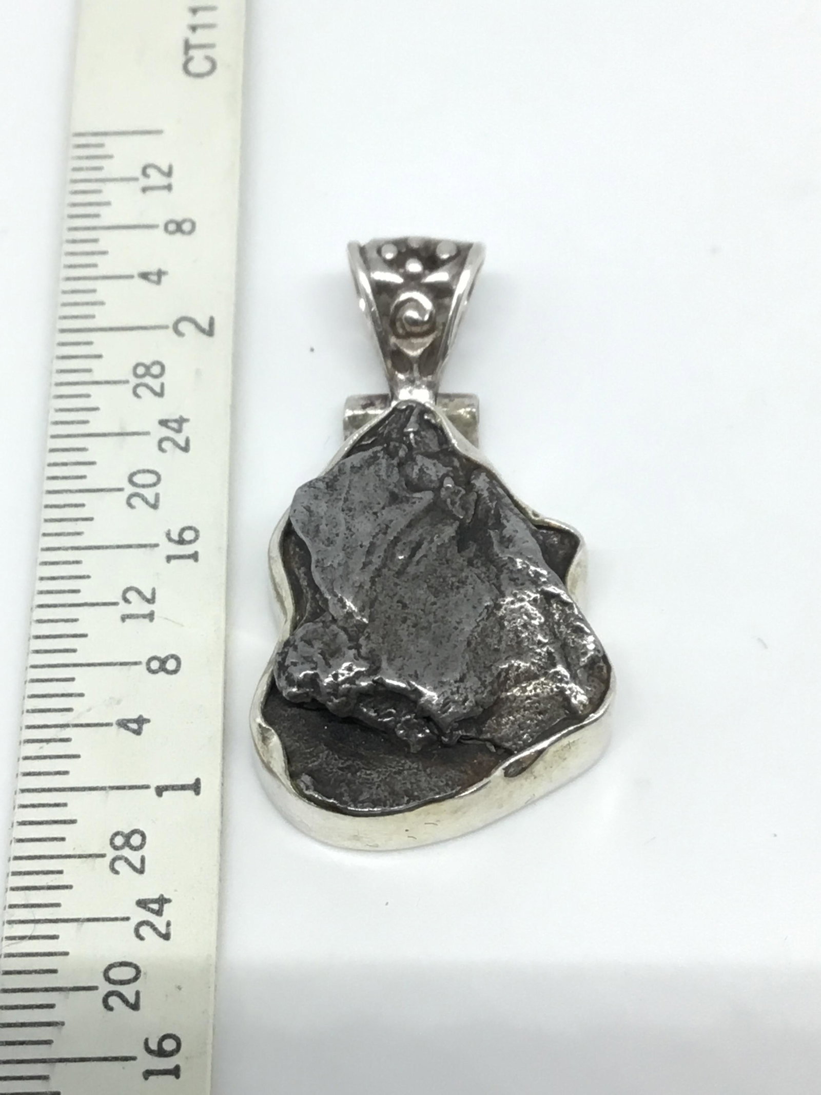 Meteorite Pendant: Encased in Sterling Silver with Sterling Bezel