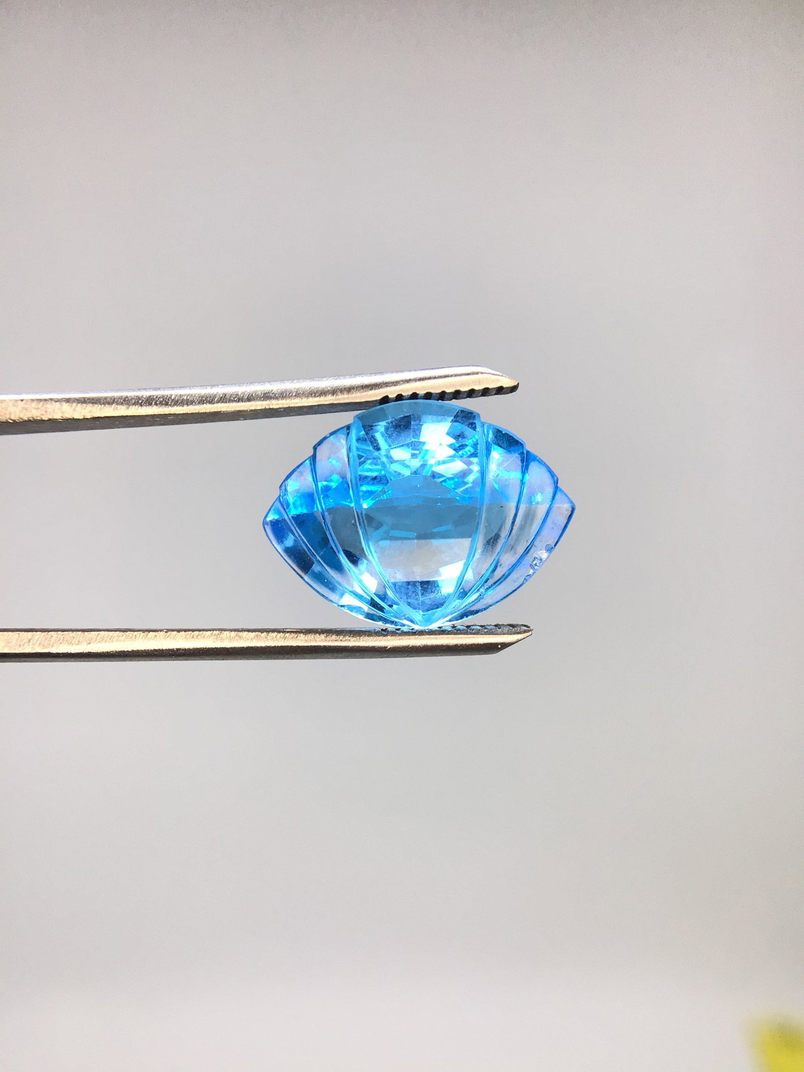 Blue Topaz: Seashell Marquise cut blue topaz. 11.90 carats. 2.39 grams.