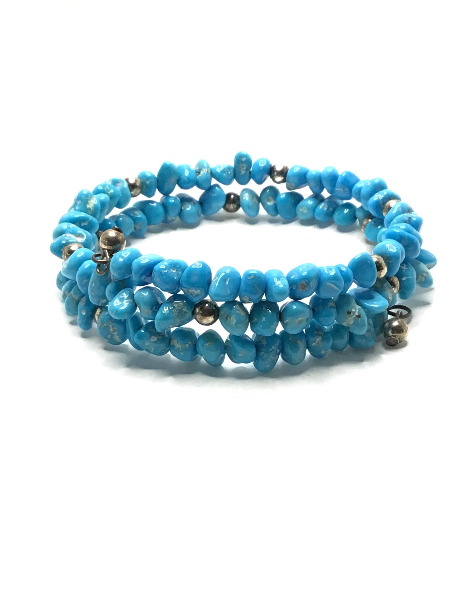 Navajo handmade bracelet: Navajo handmade bracelet with Kingman turquoise and silver beads. 17.23 grams total weight. Made by Corina Smith.