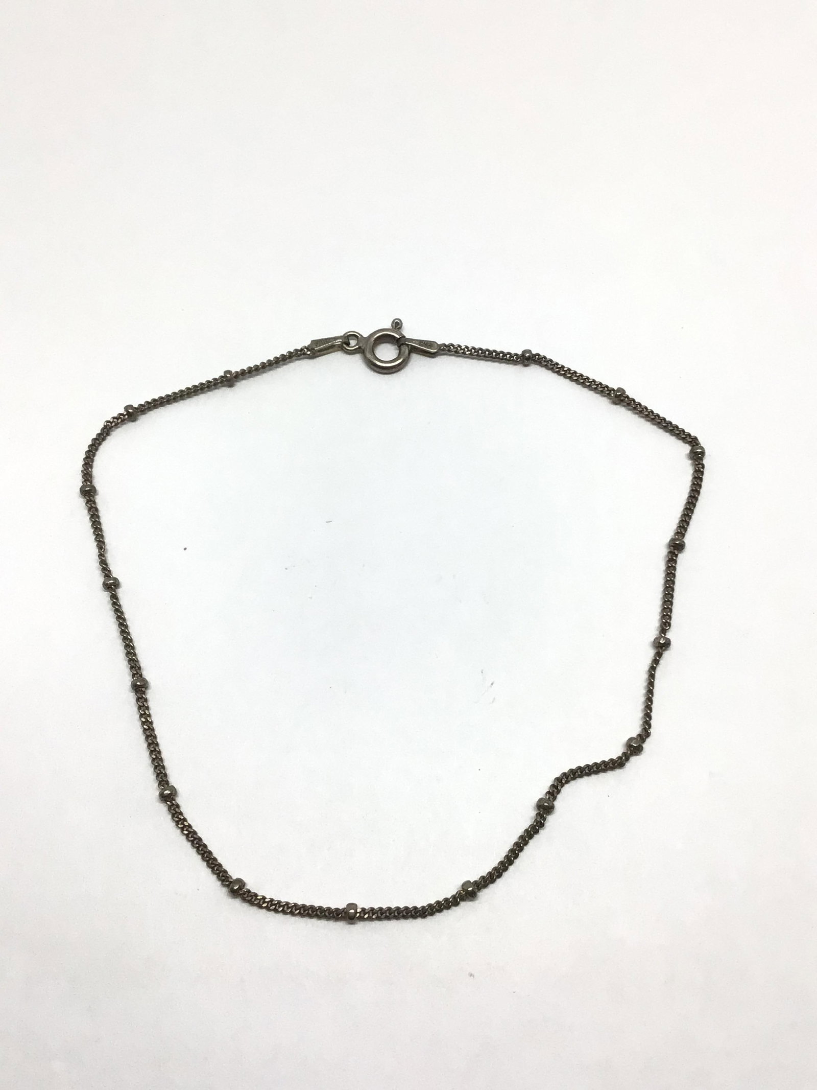 Sterling silver bracelet: Sterling bracelet of 9 inches length. 1.52 grams total weight.