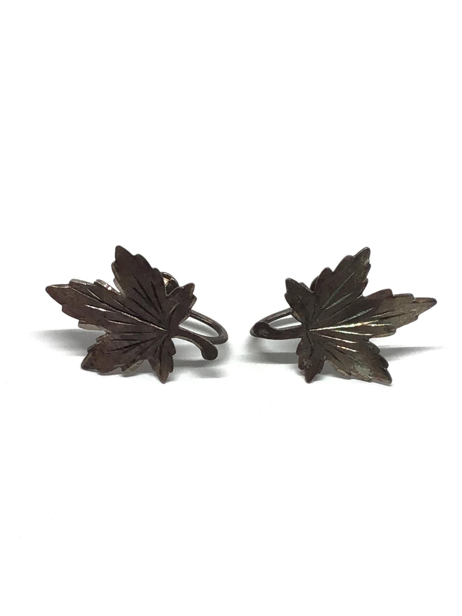 Sterling silver earrings: Sterling screw back earrings with maple leaf motif. 3.15 grams total weight.