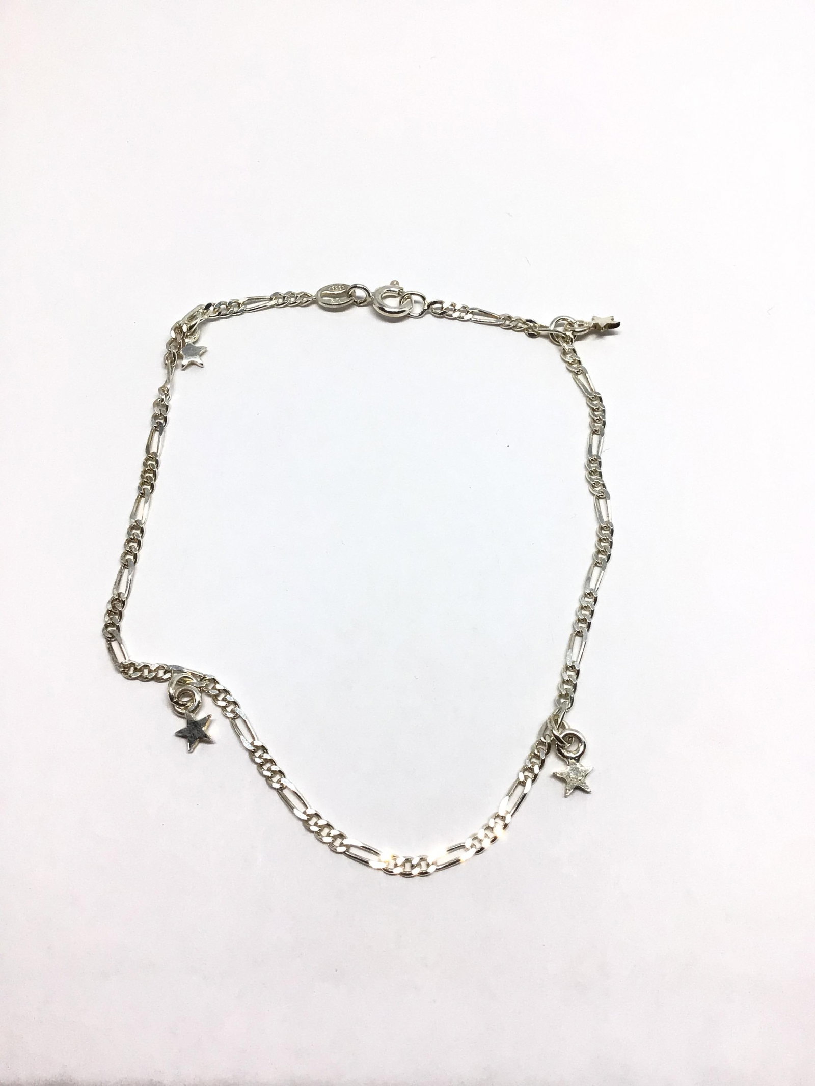 Sterling silver bracelet: Sterling bracelet with star shaped dangles. 2.93 grams total weight. 9 inches length.