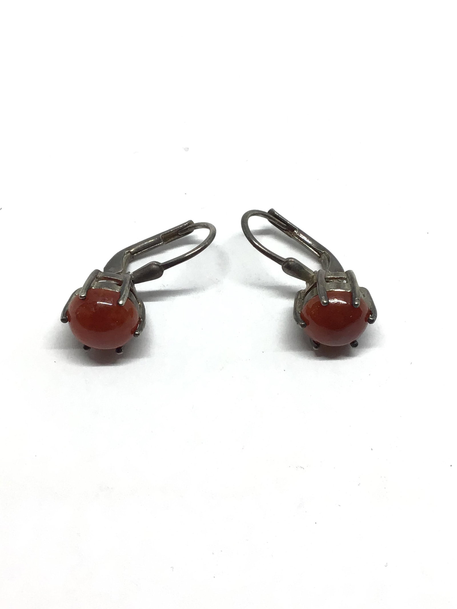 Sterling silver earrings: Sterling earrings with spinel cabochon gemstones. 2.77 grams total weight.