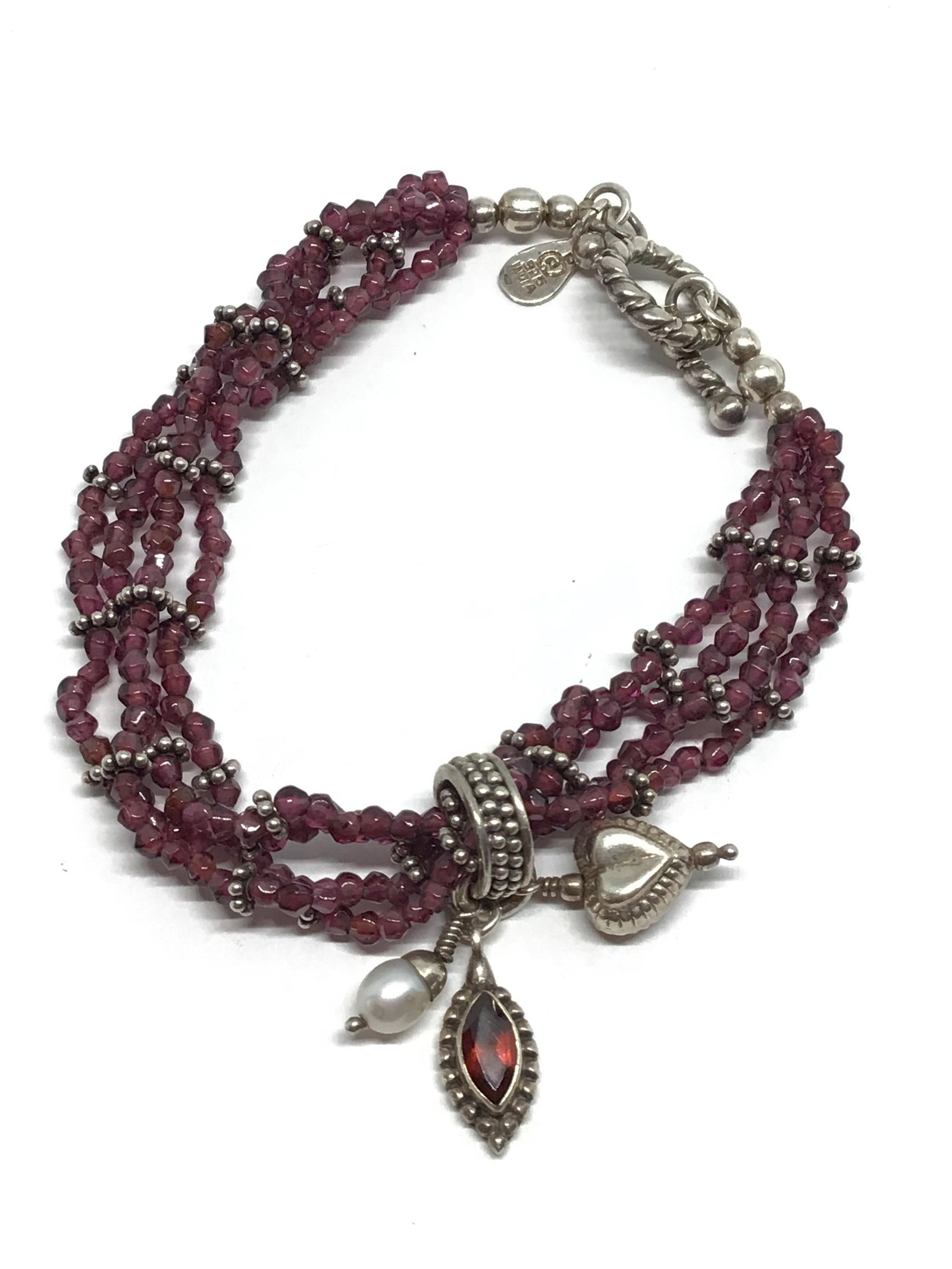 Beaded bracelet: Garnet beaded bracelet with sterling fittings and dangle. 18.88 grams total weight.