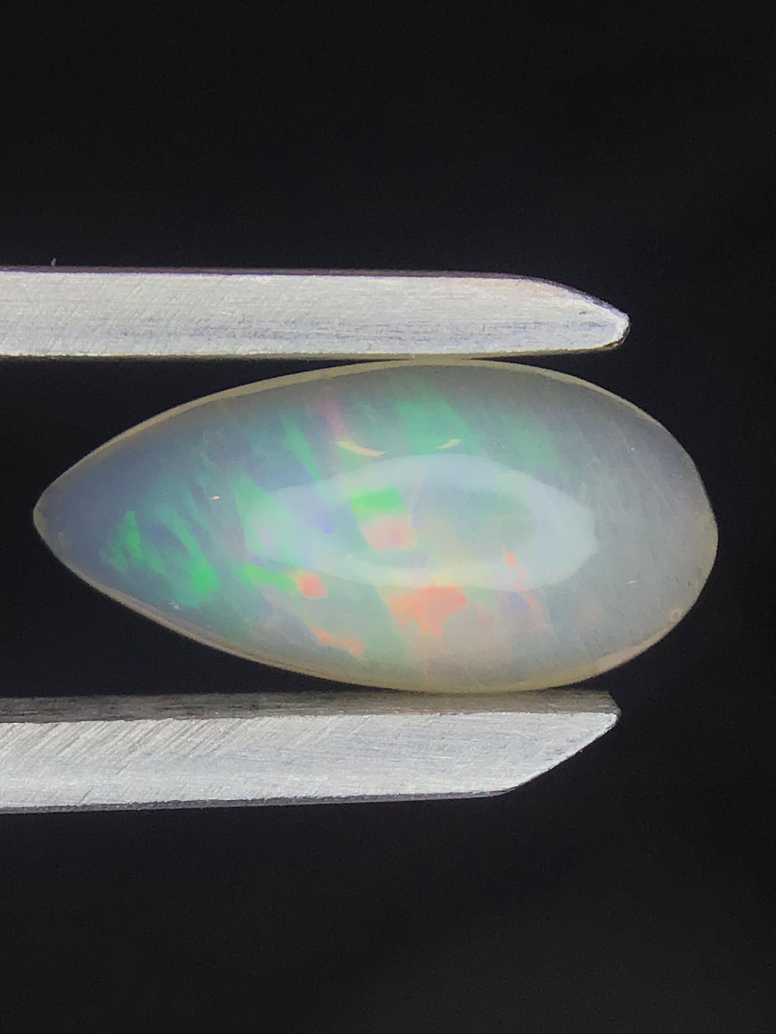 Opal 1.05 ct: Cabochon cut Opal from Ethiopia. 1.05 ct. .21 grams