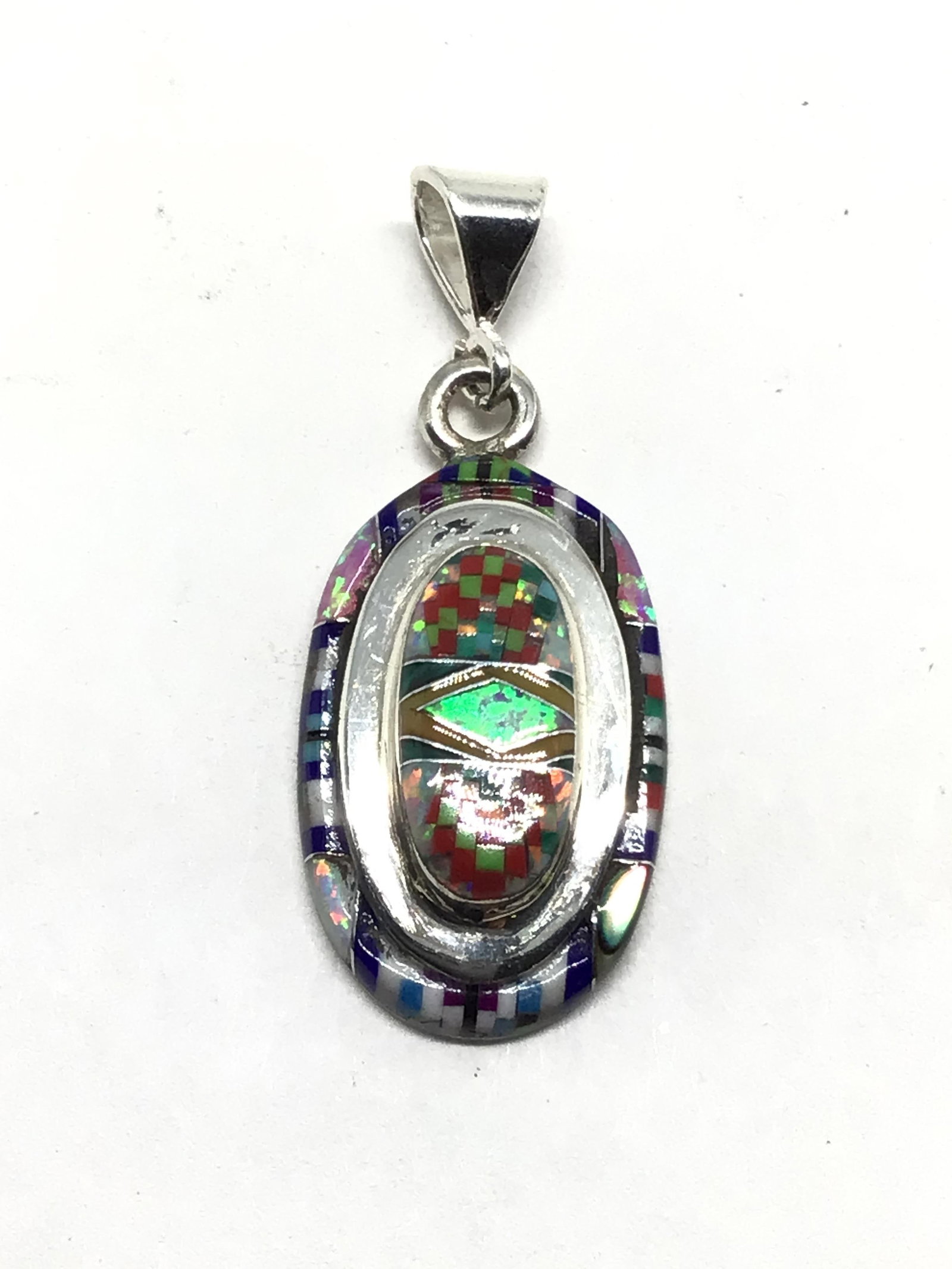 Southwest style pendant: Sterling silver 2 stack pendant with multiple stone inlay. 2.85 grams total weight.