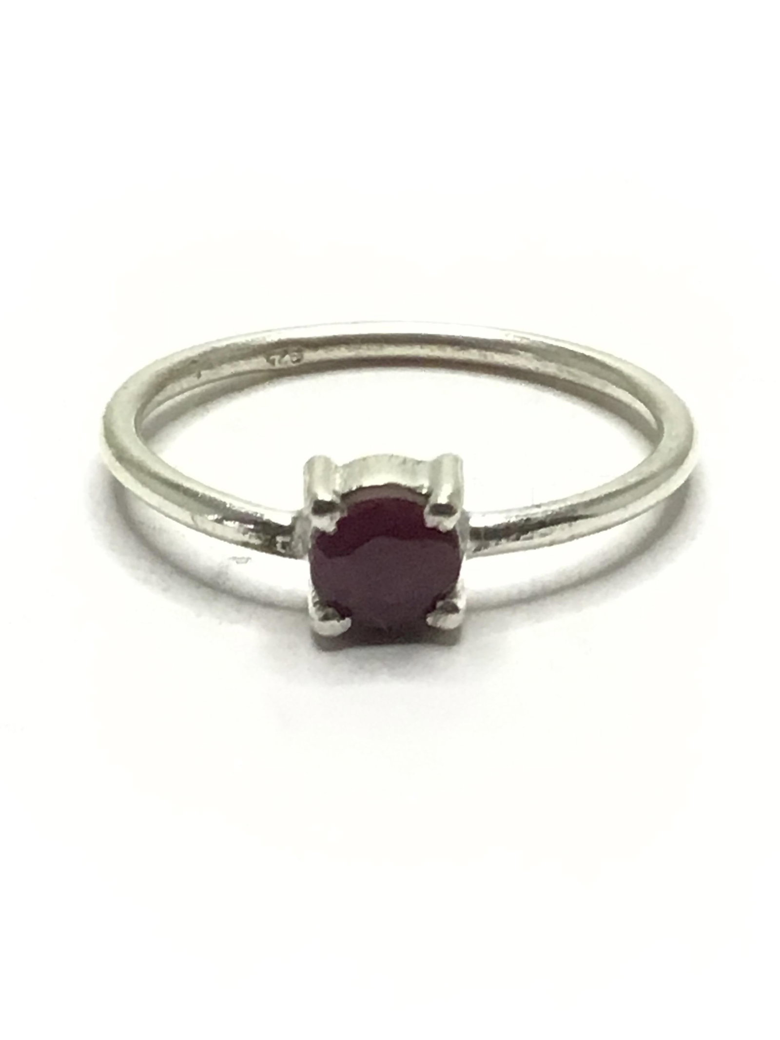 Sterling dainty ring: Sterling Silver ring with ruby gemstone. 1.39 grams total weight. Size 7