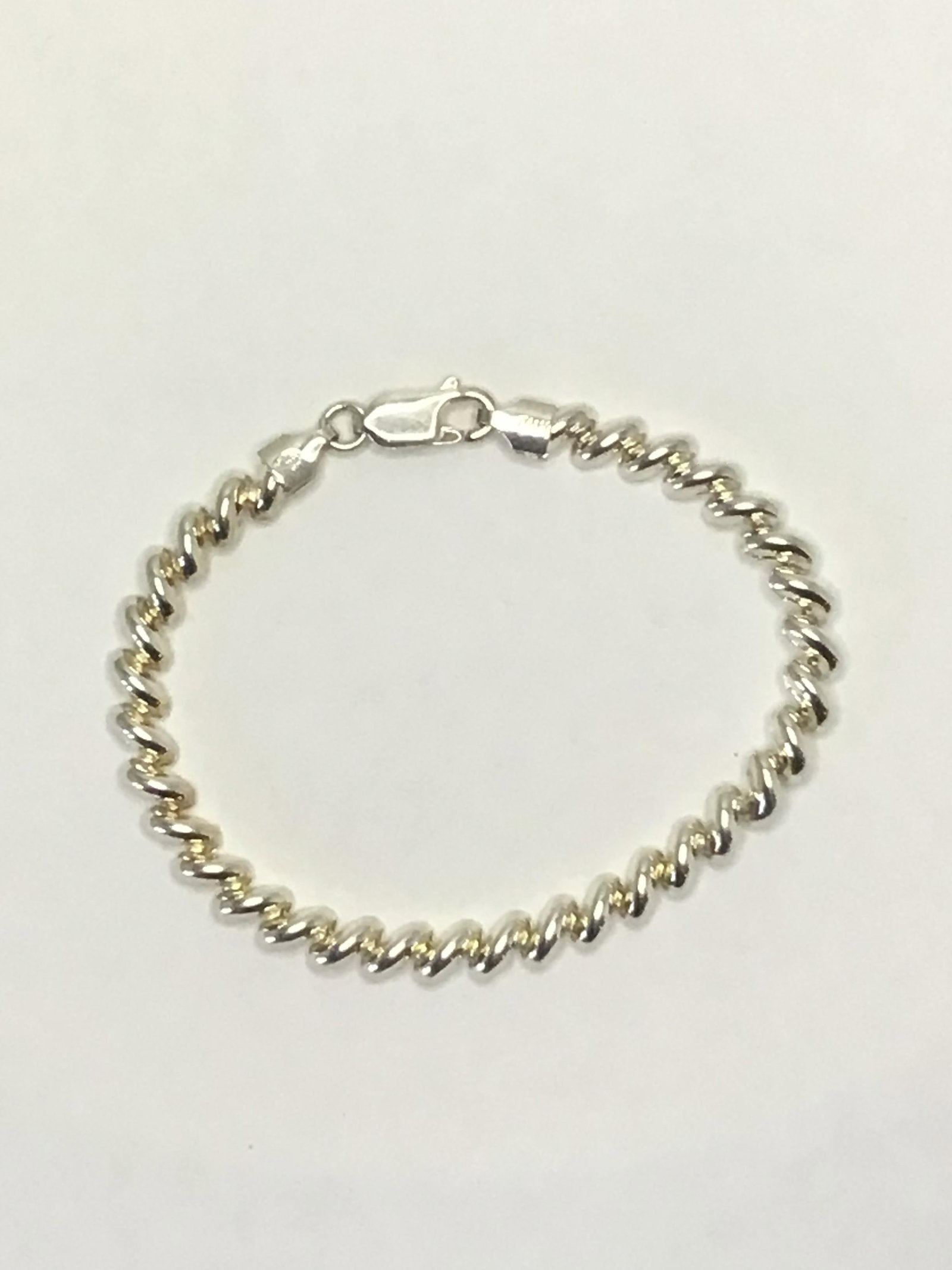 Sterling Silver bracelet: Sterling bracelet weighing 7.44 grams total. 7 inches length.