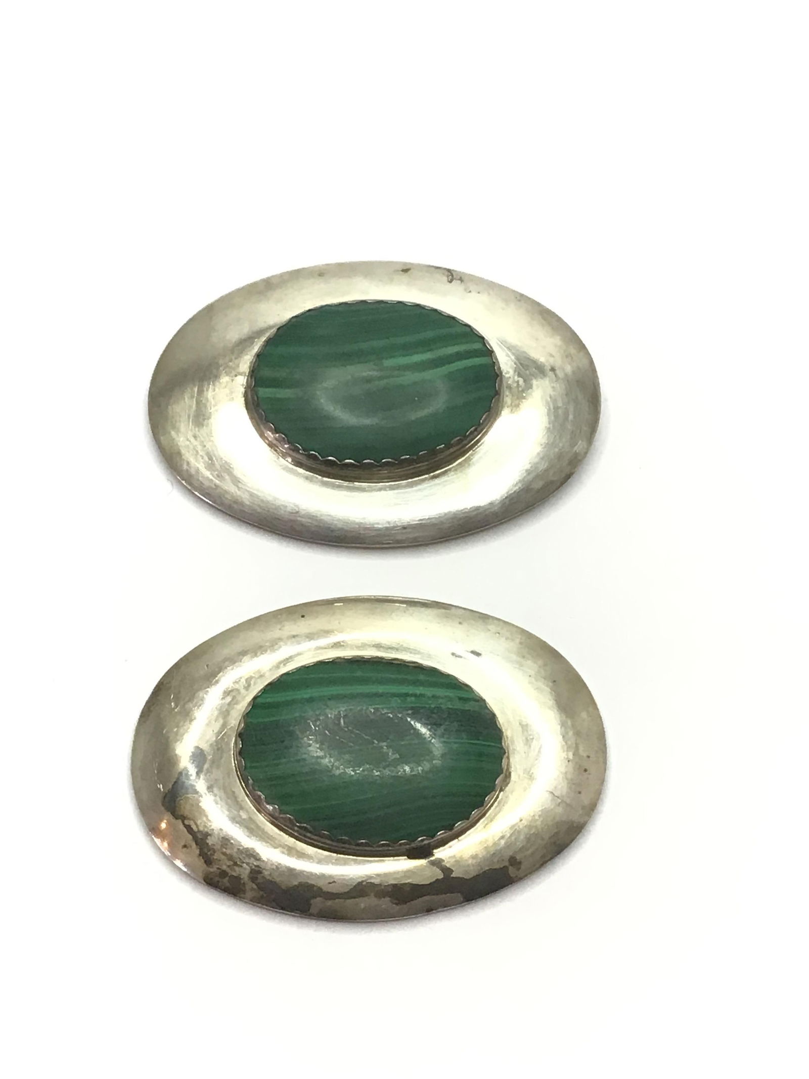 Artisan made conchos: Sterling silver conchos with malachite stones. 42.46 grams total weight. Hallmarked BY.