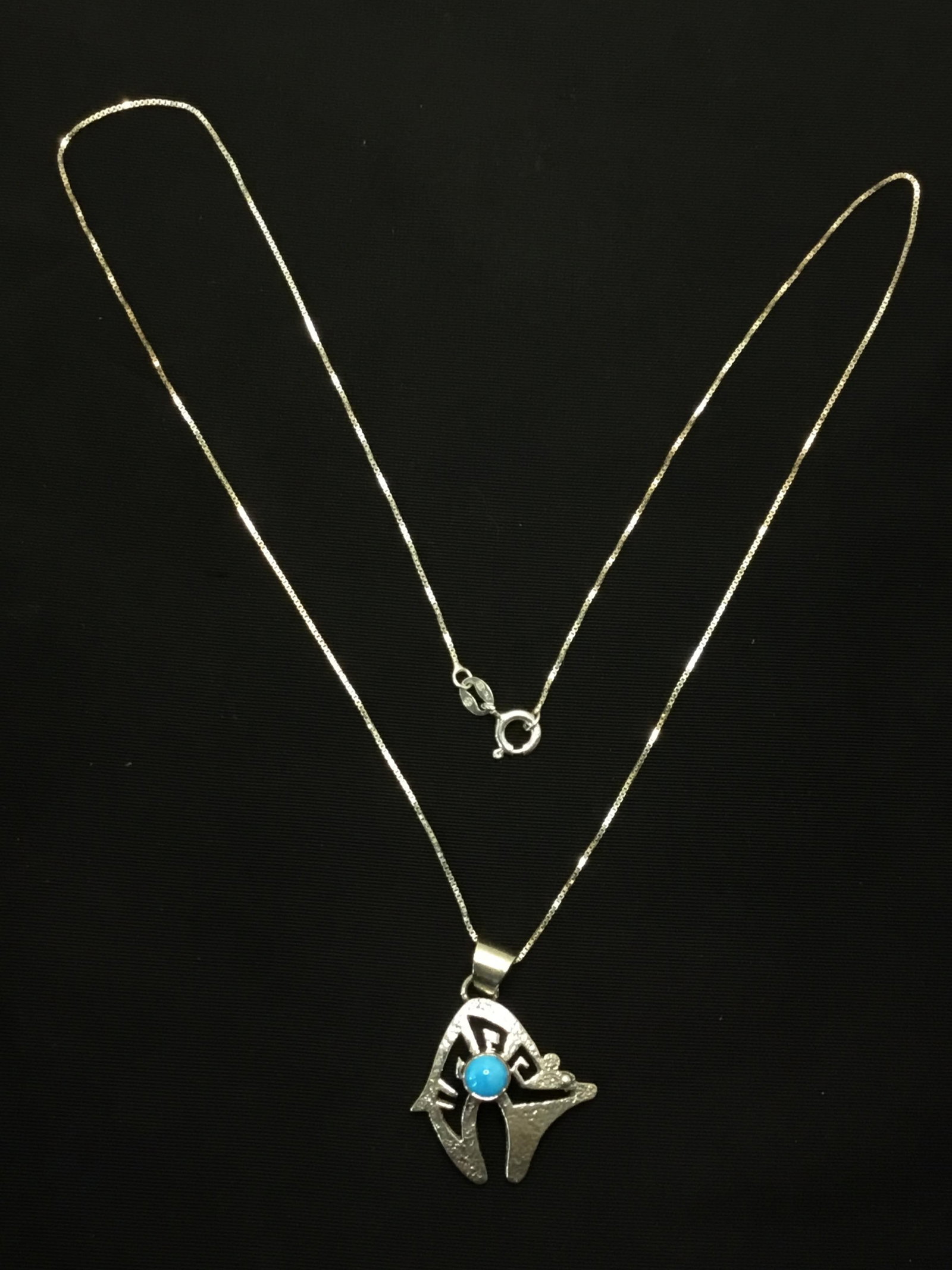 Navajo handmade necklace with pendant: Sterling silver necklace with pendant featuring Kingman turquoise stone. 5.28 grams total weight. 18 inches length. Made by Allen Lee.
