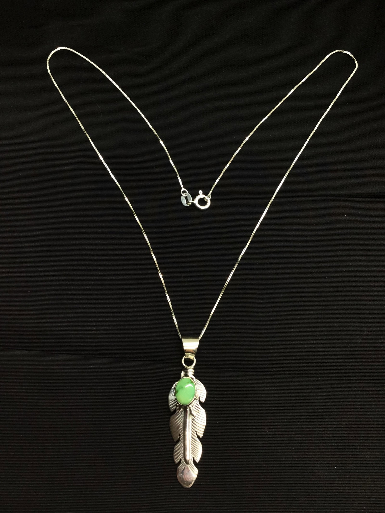 Navajo handmade necklace and pendant: Sterling necklace with Sterling pendant with turquoise stone. 5.61 grams total weight. 18 inches length. Navajo made by Jane Defauito.