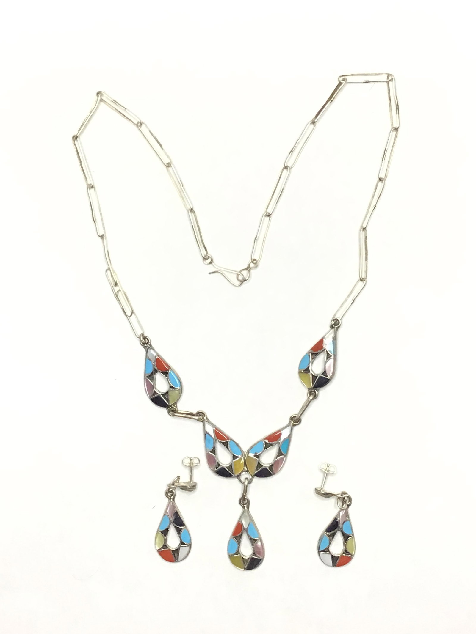 Zuni handmade jewelry set: Sterling silver necklace and matching earrings featuring multiple stone inlay. 17.34 grams of total weight. Necklace 17 inches in length. Made by Emma Bowakaty. 110