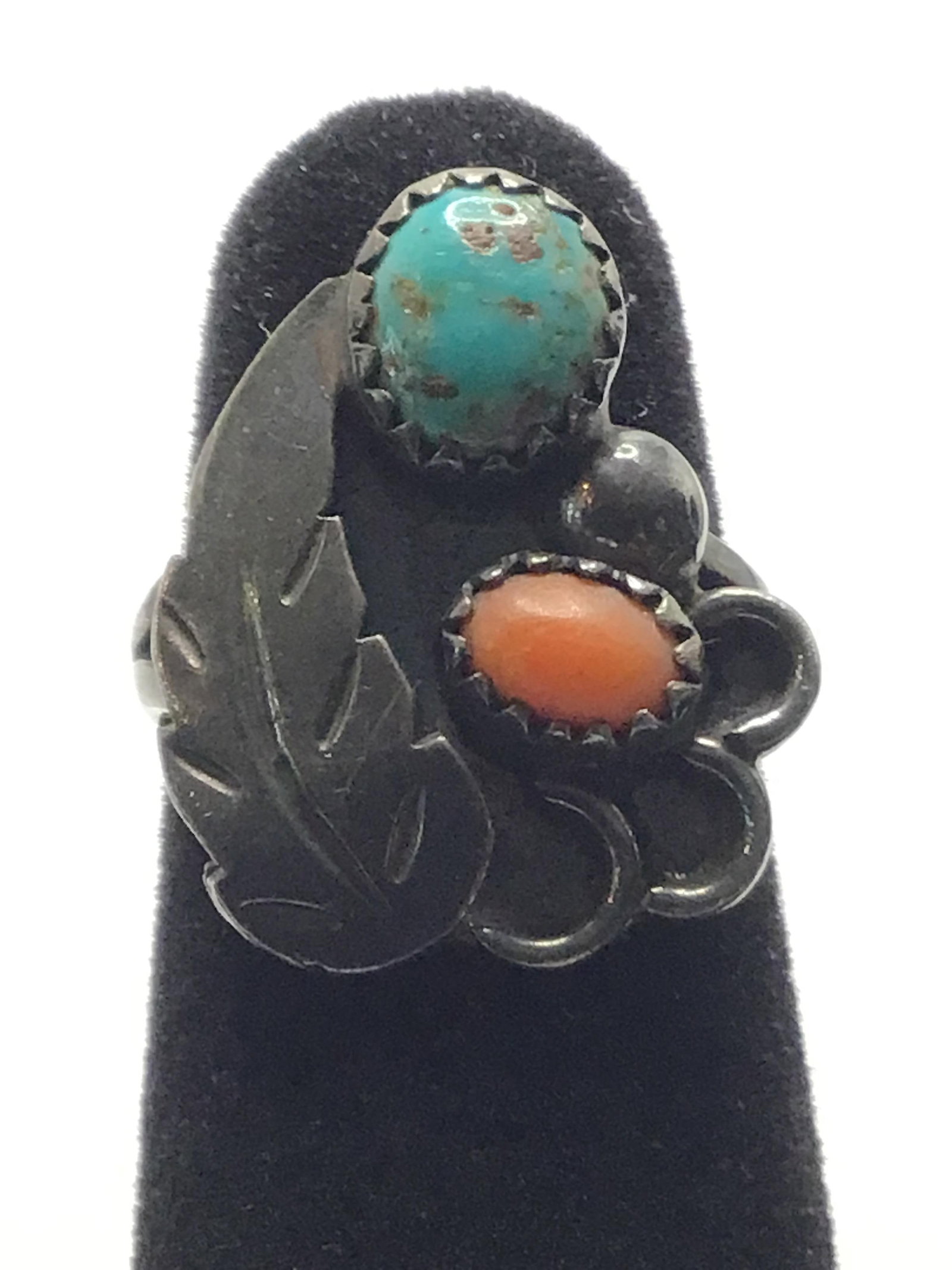 Artisan made ring: Sterling silver ring with turquoise and red coral stones. 5.18 grams total weight. Size 4 1/2. .97 per gram