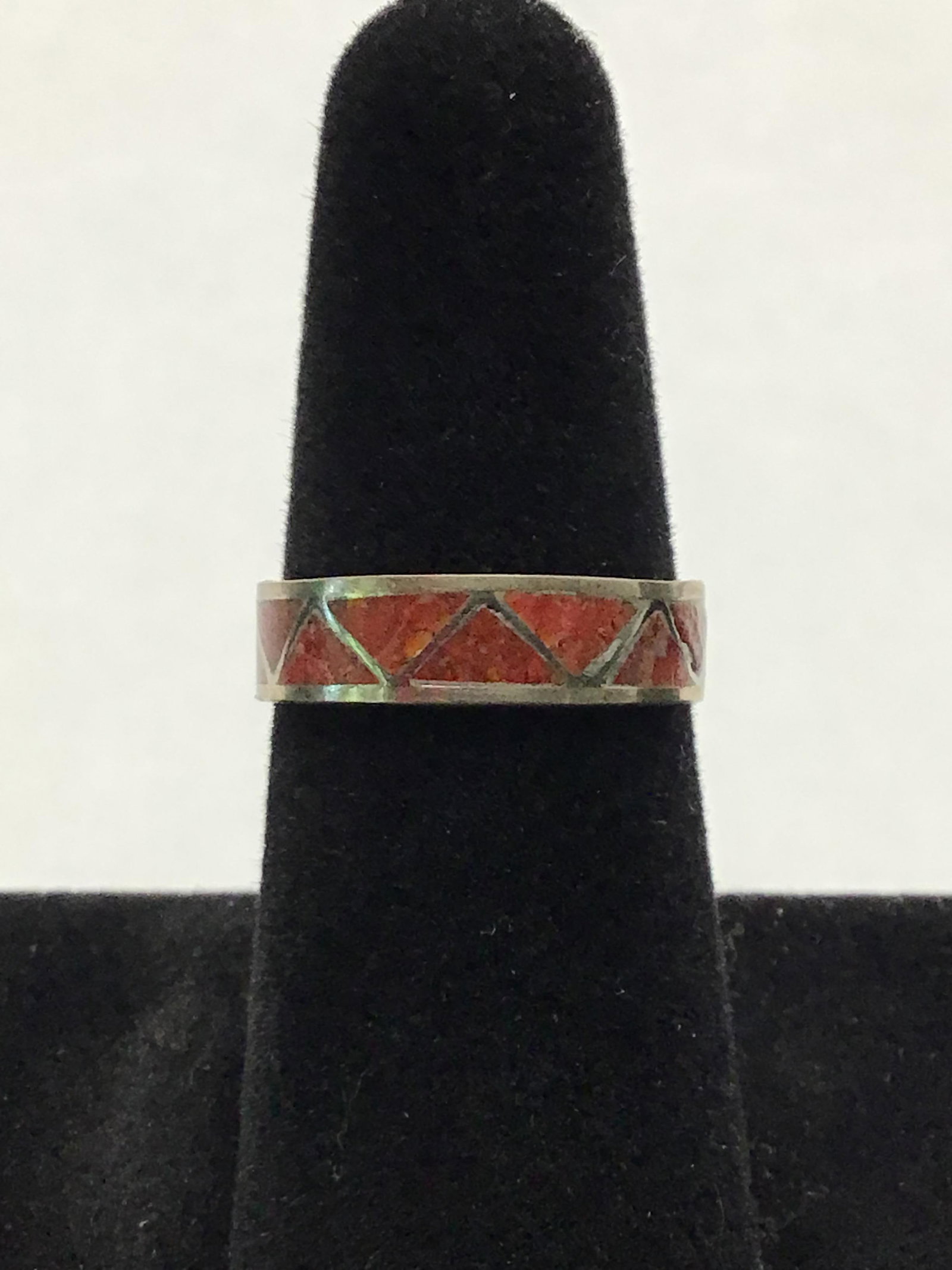 Navajo Handmade ring: Sterling silver ring with red coral inlay. 1.69 grams total weight. Size 9 1/2. Made by Roger Morgan. 13.20
