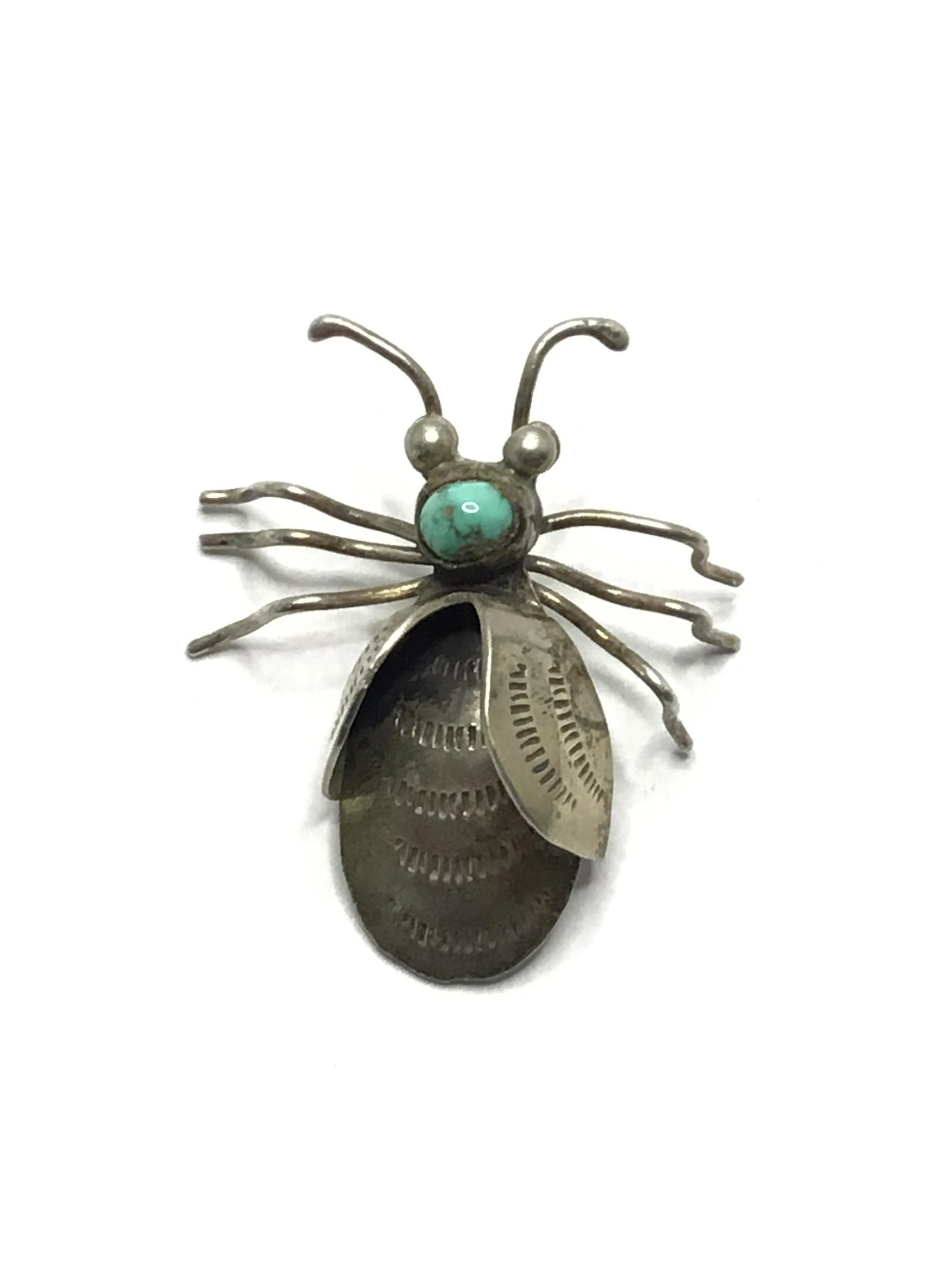 Artisan made brooch: Sterling silver brooch with turquoise stone. 6.53 grams total weight. .80 per gram.