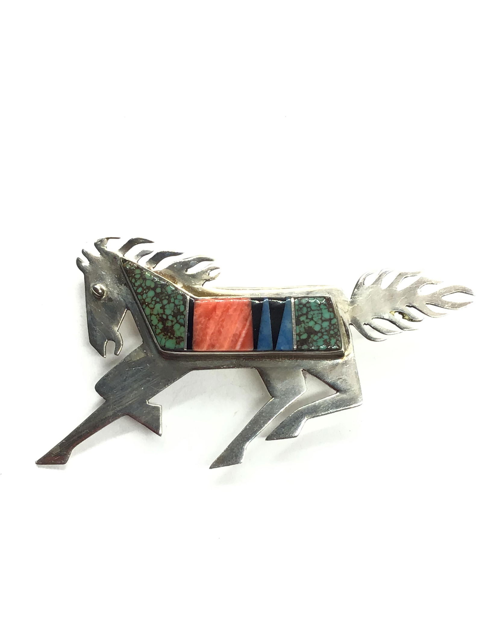 Navajo handmade brooch Sterling silver brooch featuring multiple stone inlay. 8.99 grams of total (1 of 2)