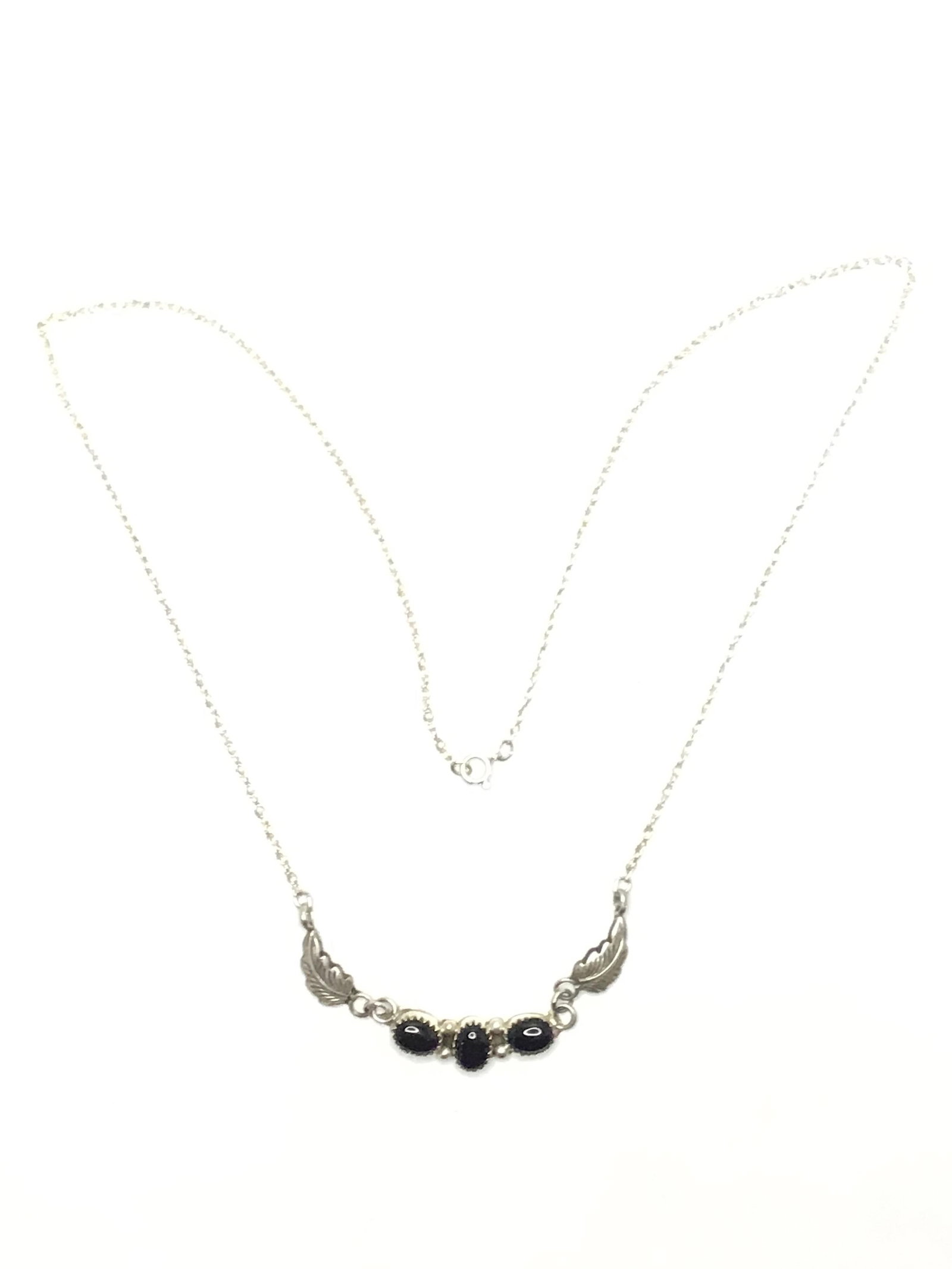 Navajo handmade necklace Sterling silver necklace with onyx stones. 5.95 grams total weight. 22: Sterling silver necklace with onyx stones. 5.95 grams total weight. 22 inches length. Made by Bobby Platero.