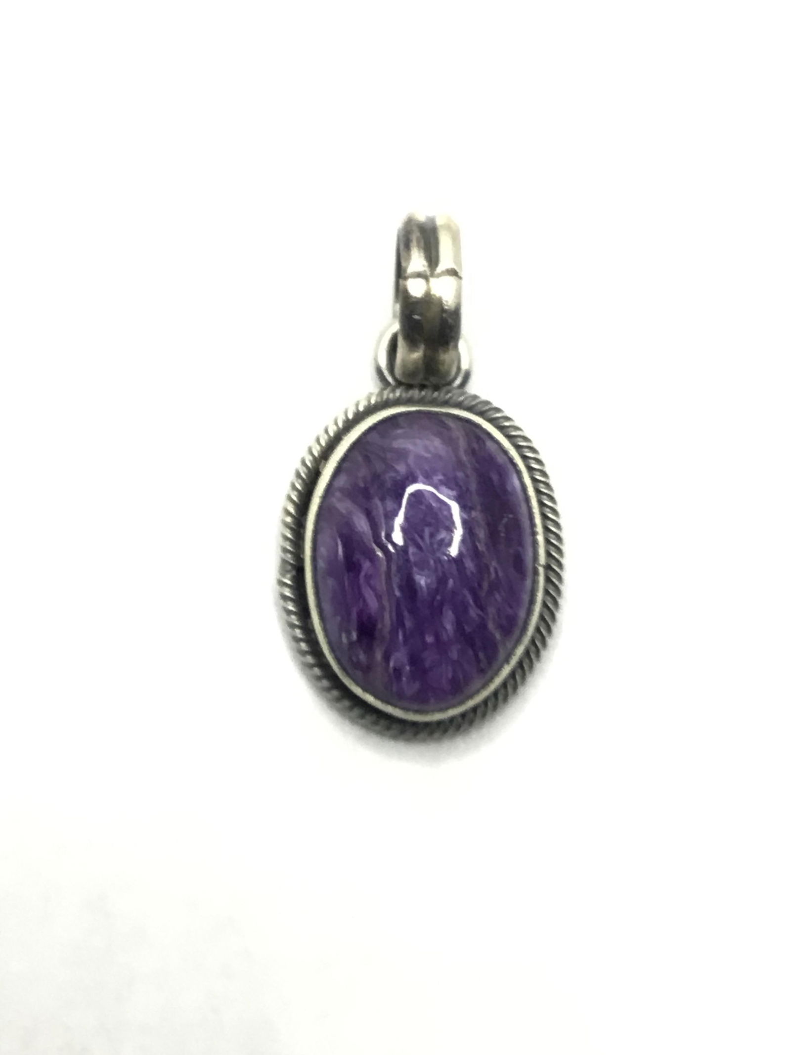Navajo handmade pendant Sterling silver pendant with Charoite stone.4.72 grams total weight. Made by (1 of 3)