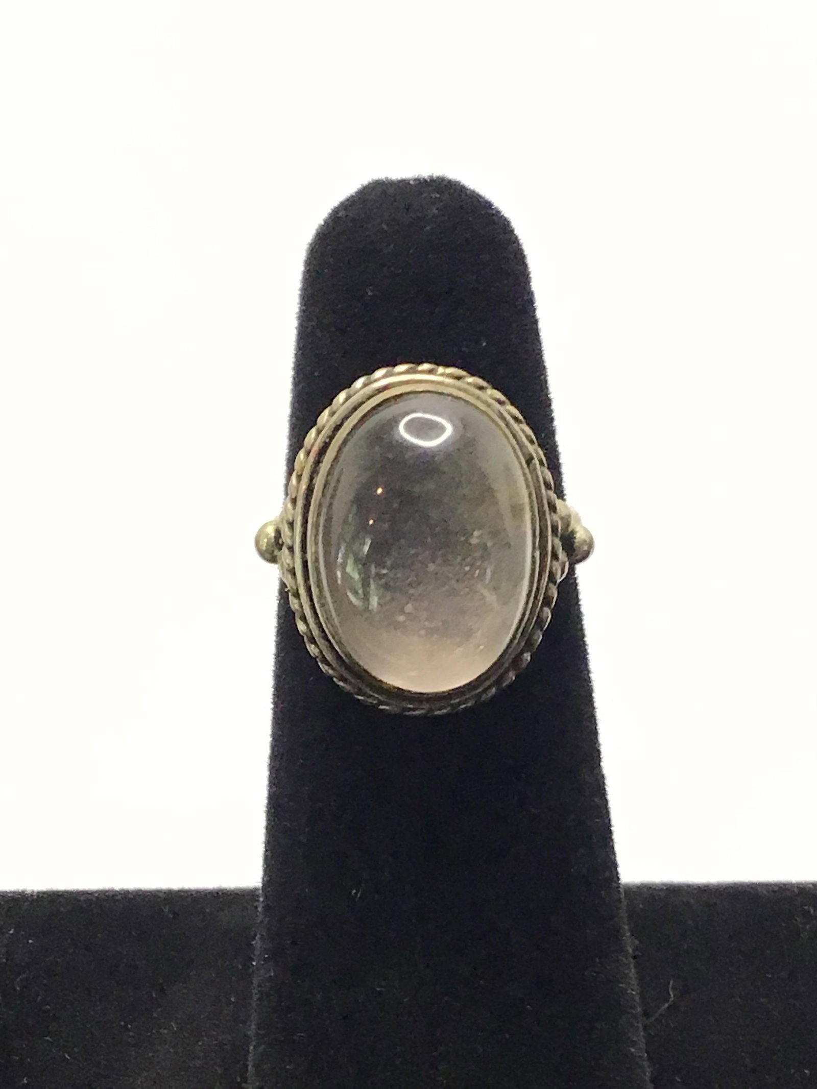 Sterling silver ring: Sterling ring with moonstone gemstones. 5.90 grams total weight. Size 6
