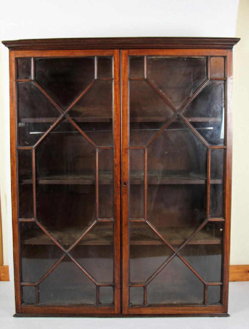 19TH CENTURY MAHOGANY BOOK CASE TOP: With fretwork glazed doors ( individual panes ) Condition note: top side cornice missing. Ht. 49 1/4 " W. 51" D. 14.5"