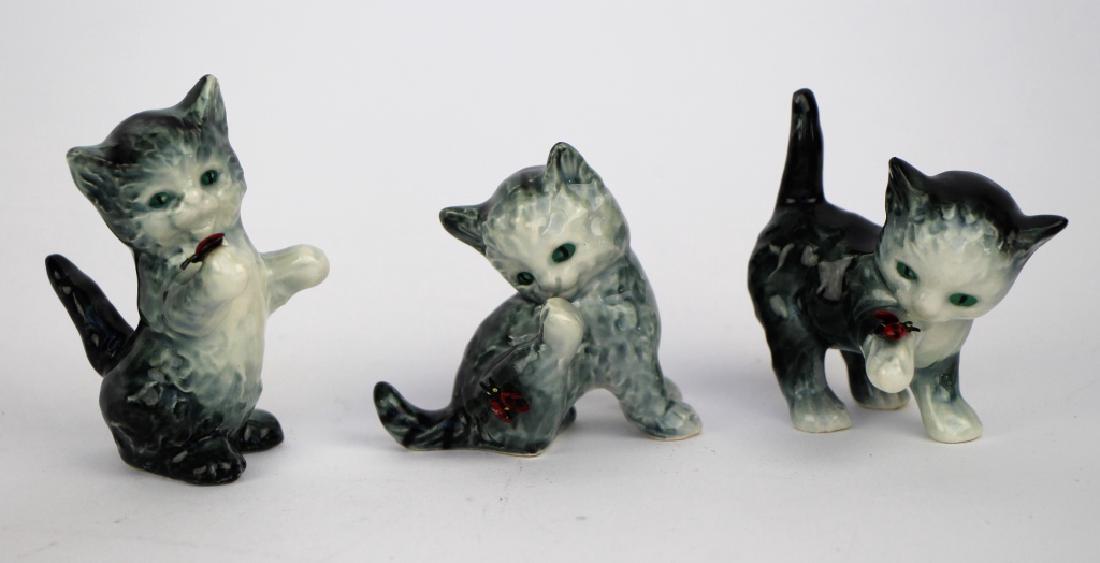 THREE GOEBEL KITTENS WITH BUTTERFLIES: All having original labels. Ht. of tallest 7 cm (2 3/4 in.) Total approx. weight 130 g.