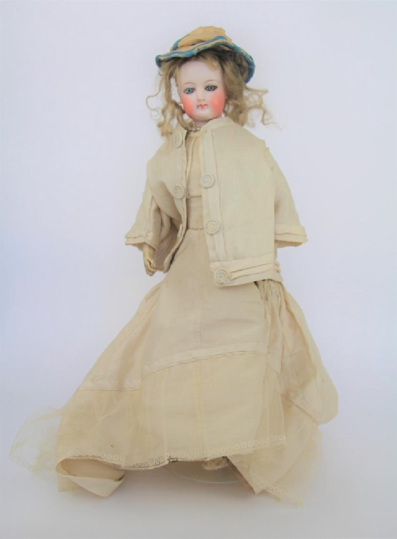 ANTIQUE BISQUE DOLL WITH LEATHER BODY (1 of 5)