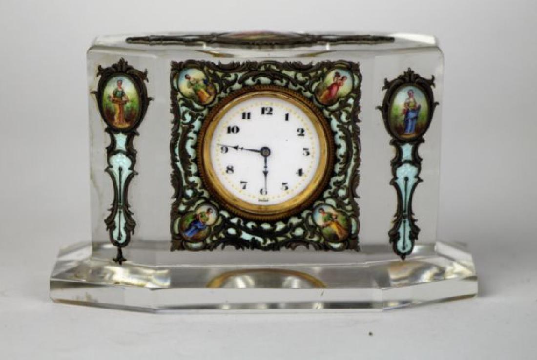 CRYSTAL AND ENAMEL DECORATED CLOCK: CRYSTAL AND ENAMEL DECORATED CLOCKSmall table top clock with ornate metalwork and hand painted enamel decoration. Length. 11 cm ( 4.25 in.) Approx. weight 600 g.