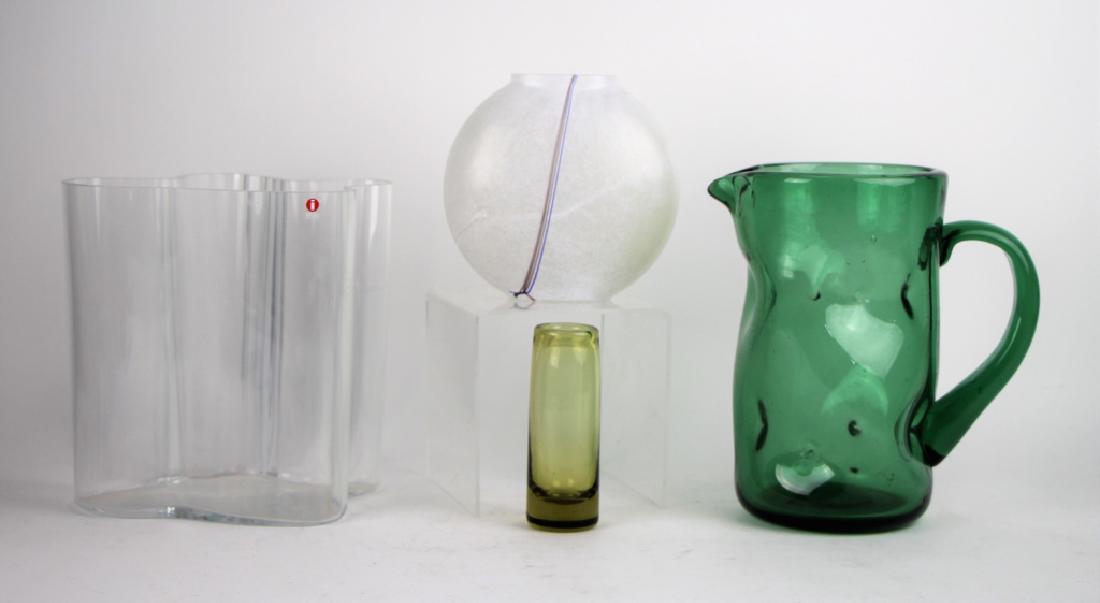 FOUR PIECES OF MID CENTURY ART GLASS: Including an Italian Empoli green glass pitcher not signed, an Alvar Aalto bowl signed, a Holmegaard bud vase, and a Boda rainbow series glass vase not signed. Total approx. weight 4.2 kg. H. 22 cm (8