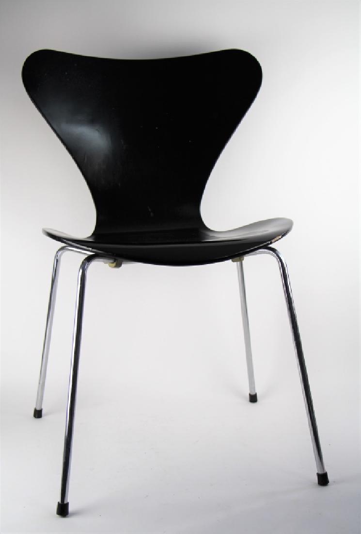 SET OF FOUR ARNE JACOBSEN DANISH CHAIRS: For Fritz Hansen, series 7, in black, dated 1985. Some wear and cracking in finish. H. 30 1/2 in. The Estate of Paul Campbell.